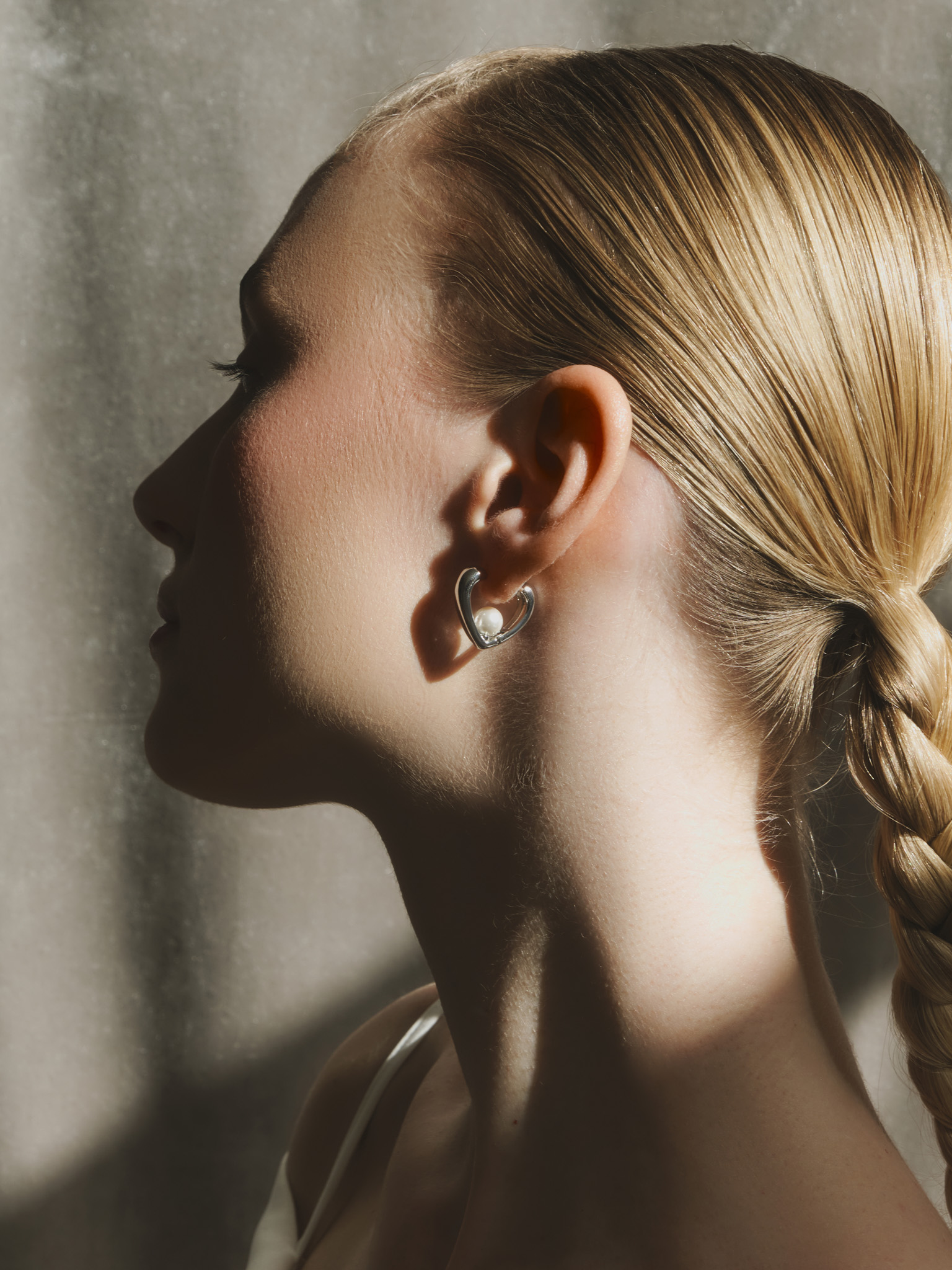 Silvertone earrings with pearl decor