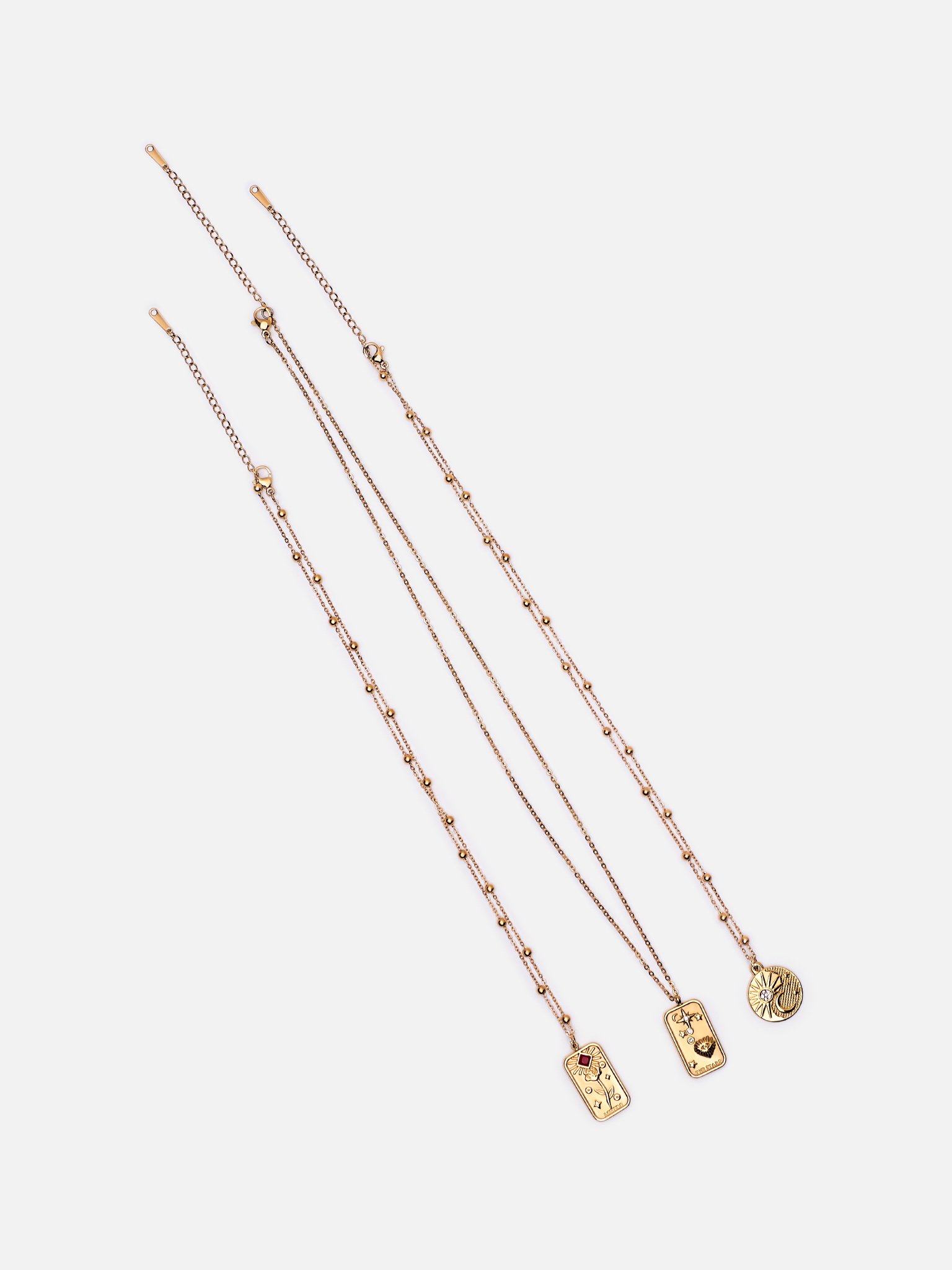 Set of three necklaces with large pendants