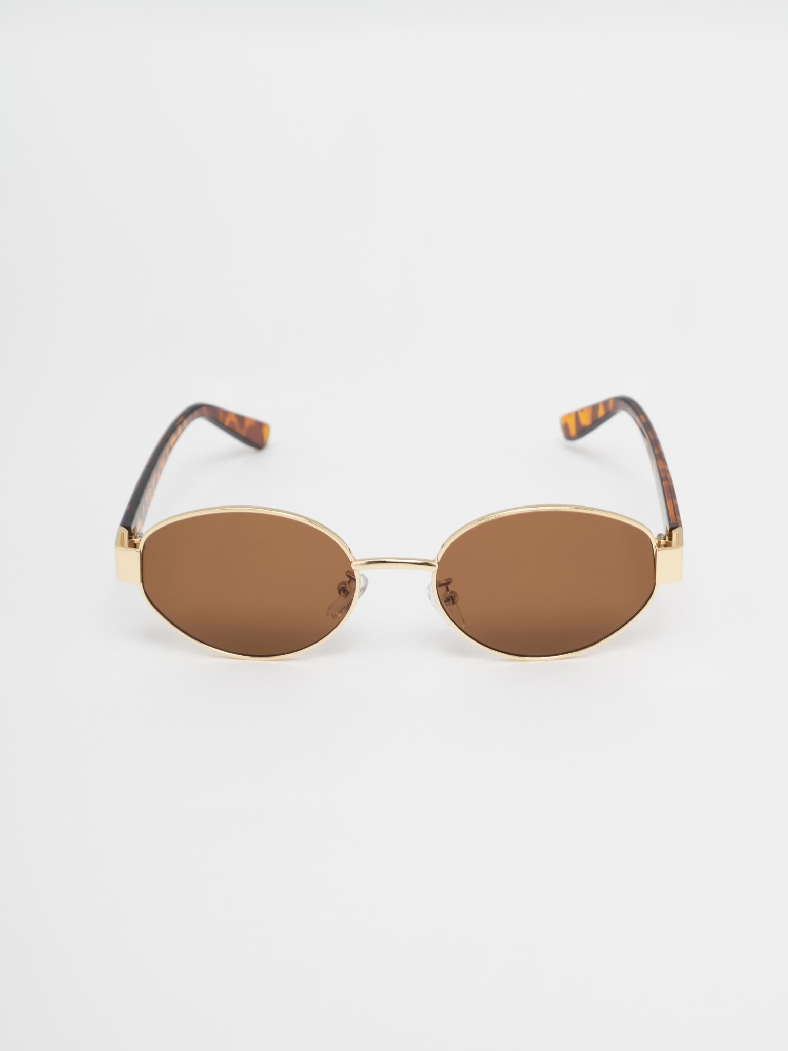 Овальные солнцезащитные очки с леопардовыми дужками