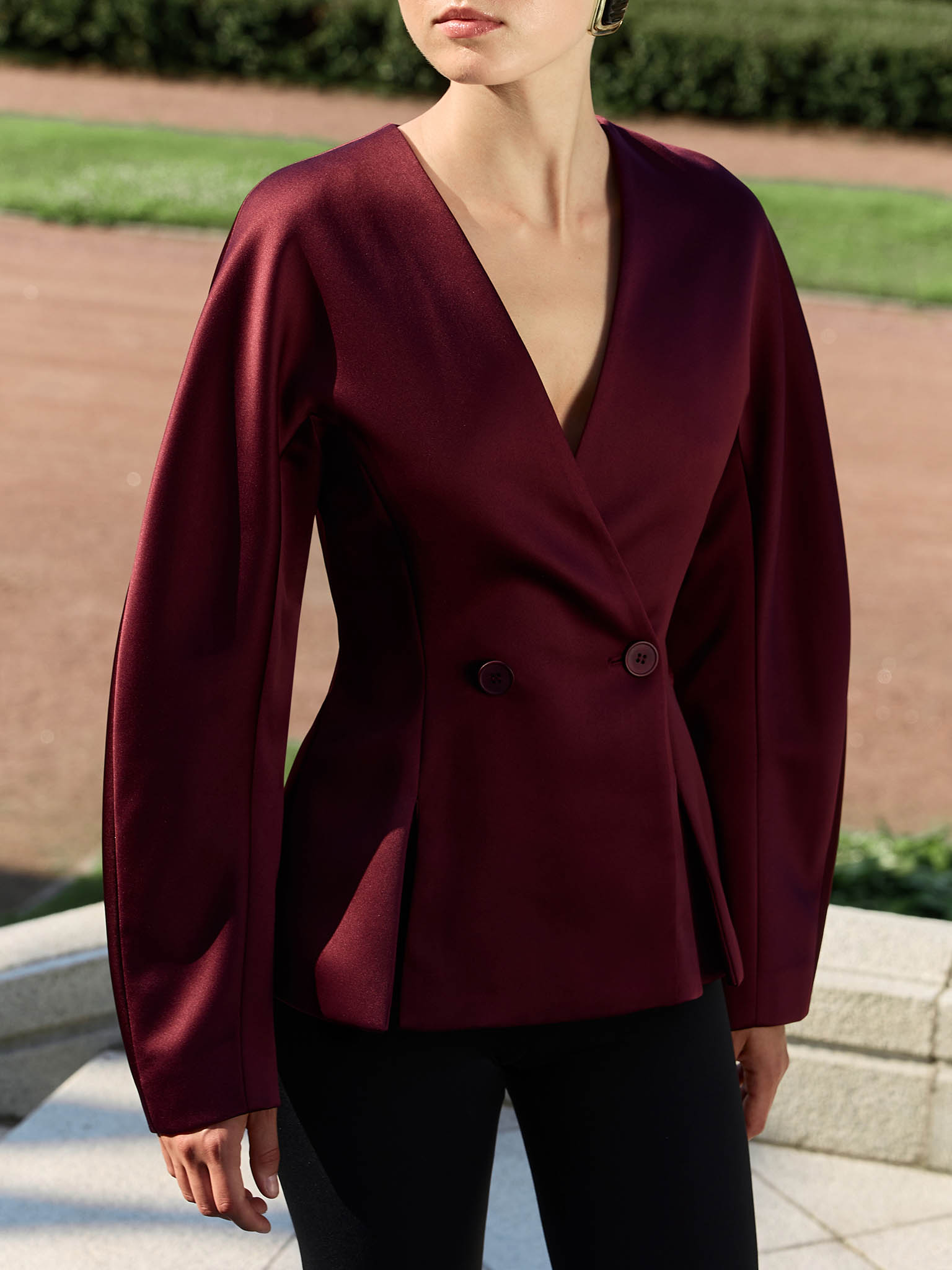 Jacket with voluminous sleeves and waist pleats
