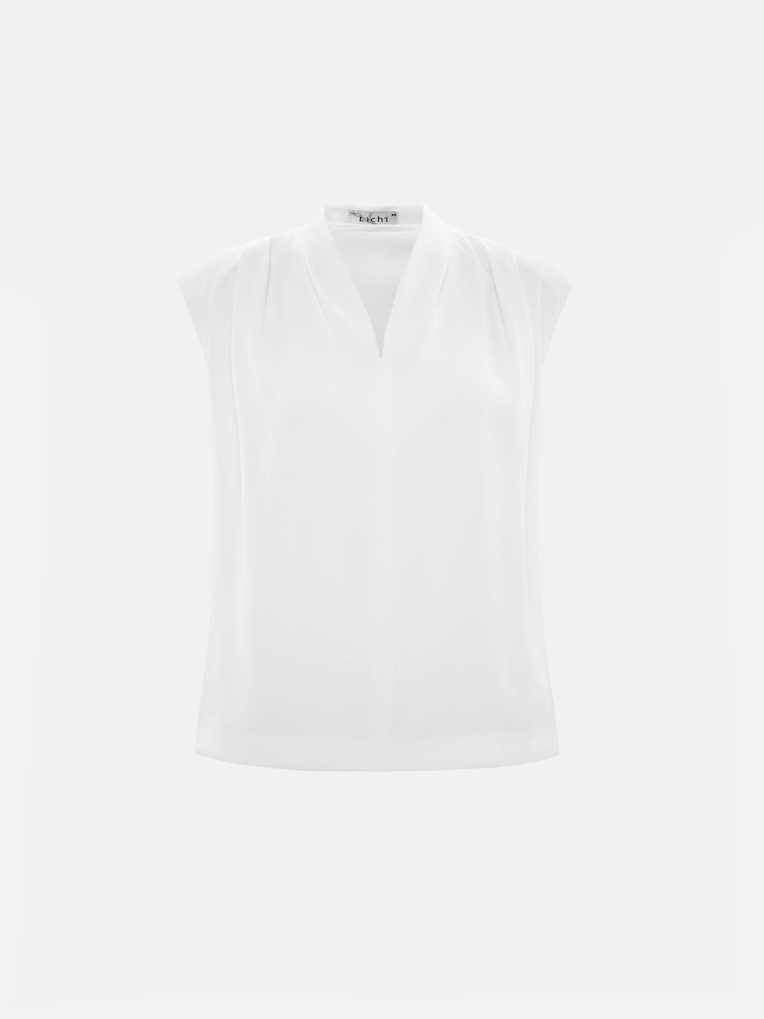 Blouse with voluminous shoulders and V-neckline