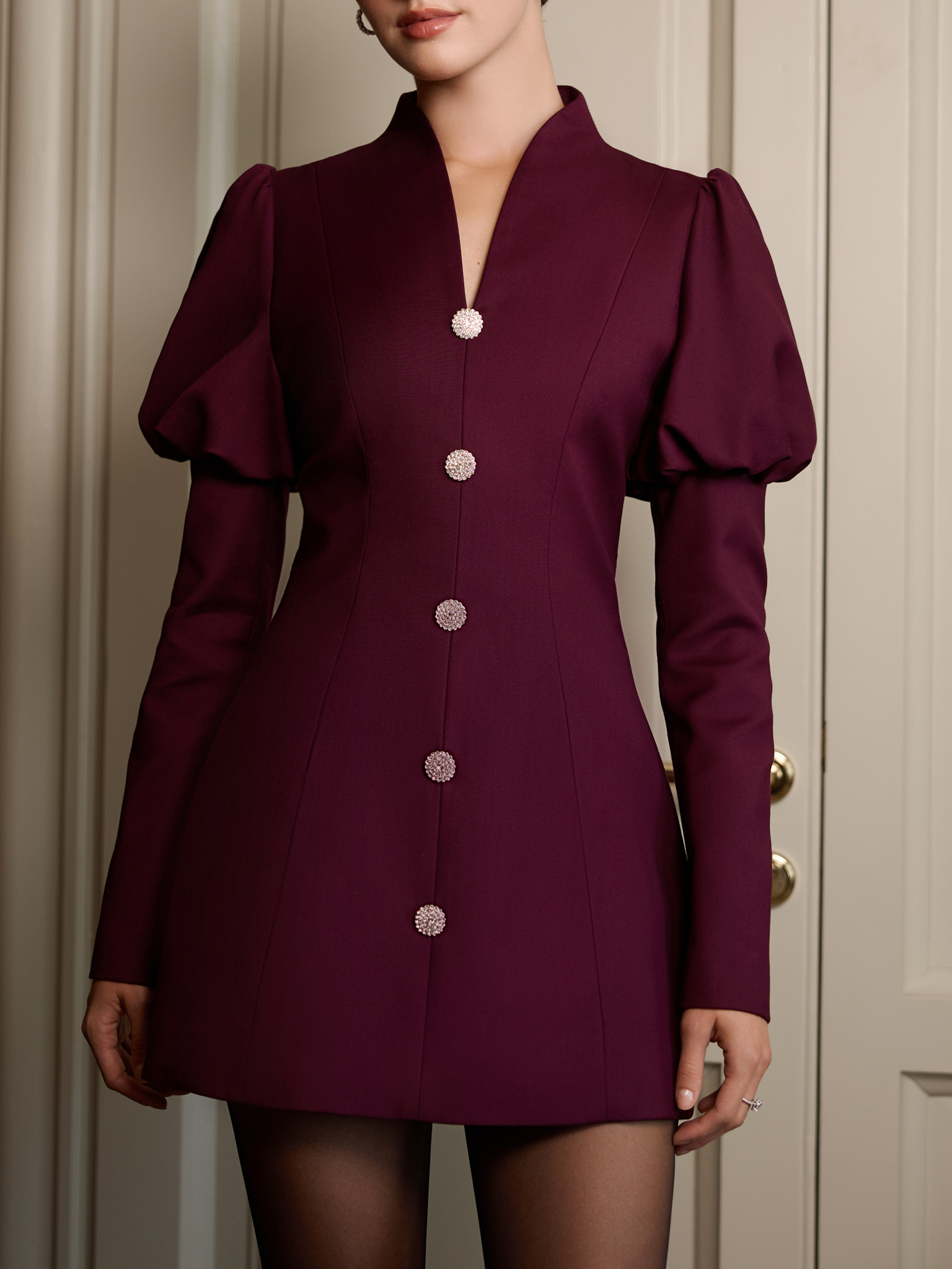Mini dress with voluminous sleeves and accent buttons