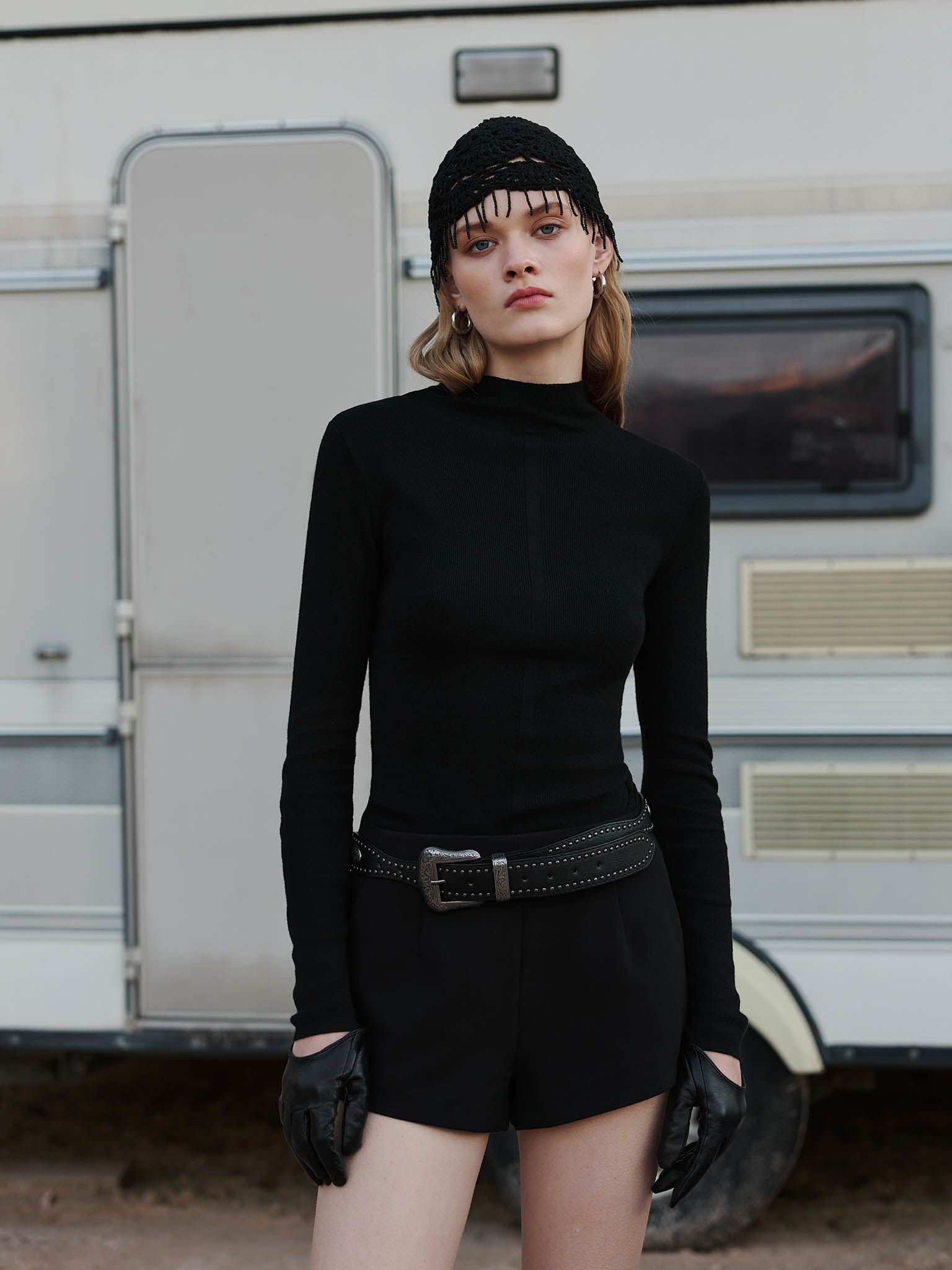 Ribbed turtleneck with a central decor