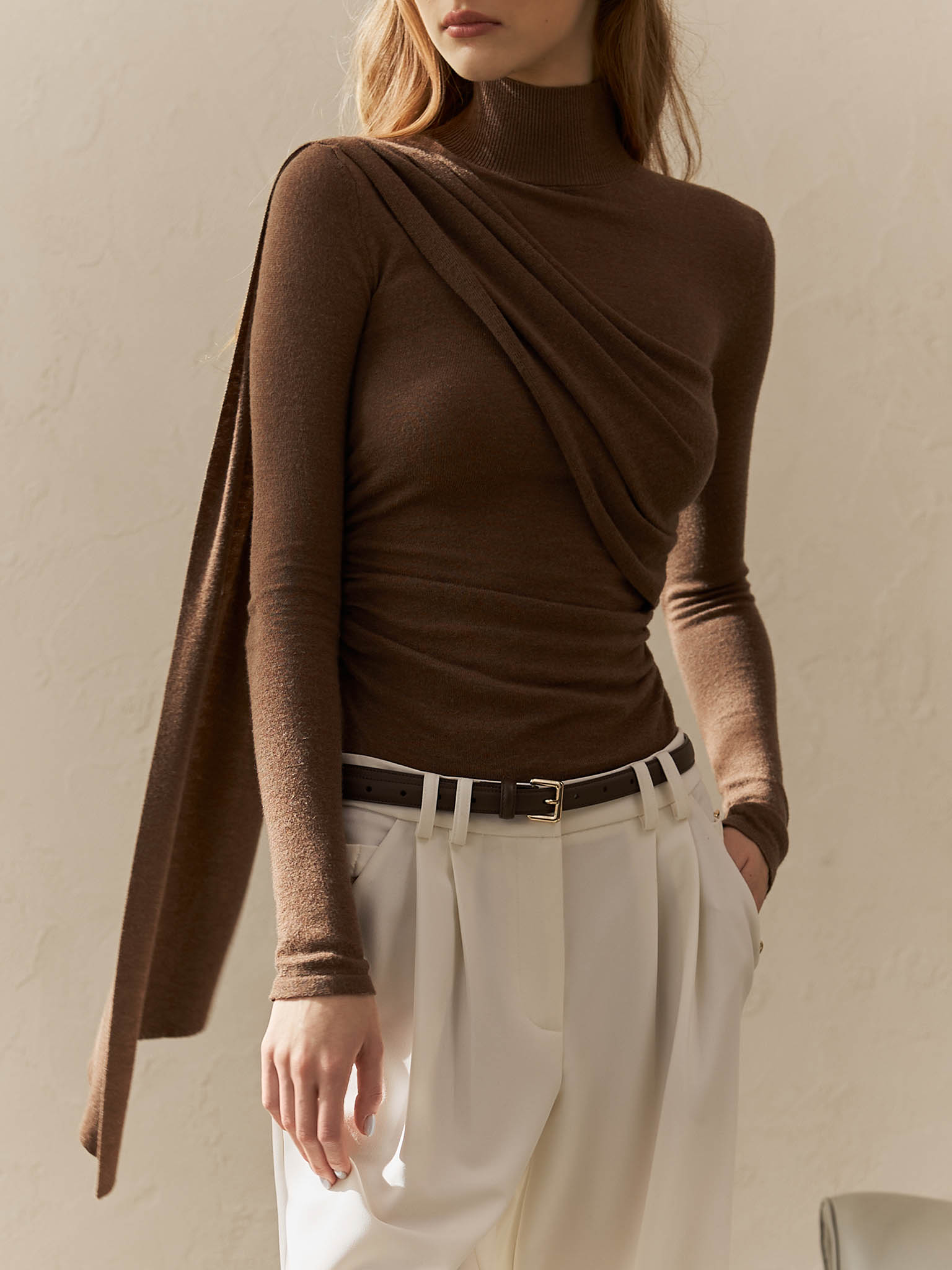 Turtleneck with diagonal drapery on the shoulder