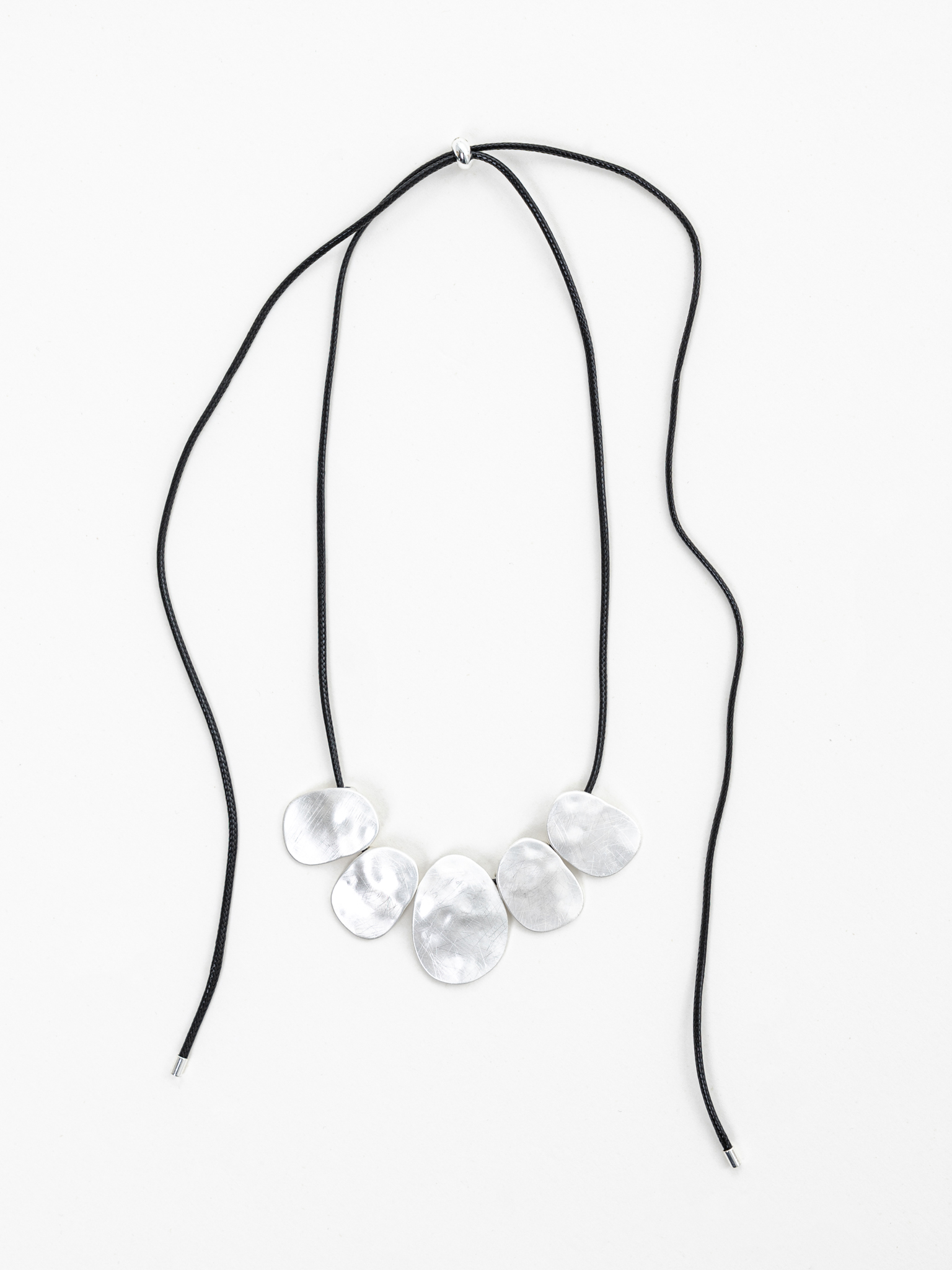 Eco-leather cord necklace with silvertone pendants