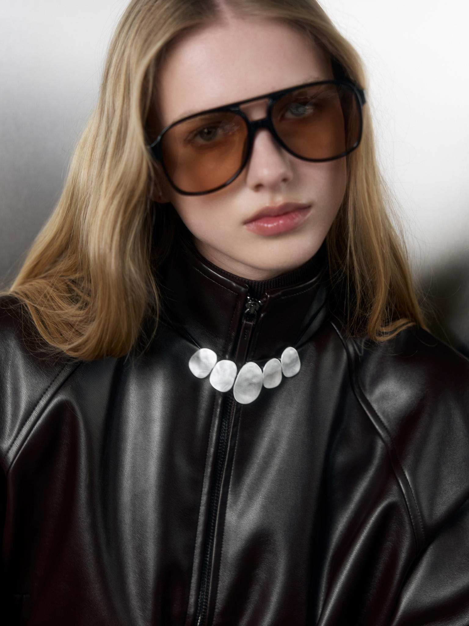 Eco-leather cord necklace with silvertone pendants