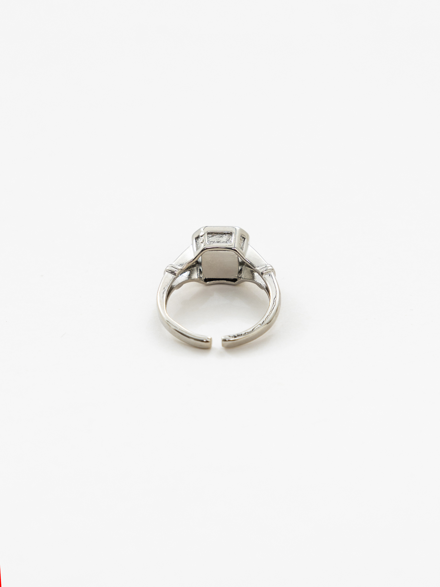 Wide silvertone ring with large crystal