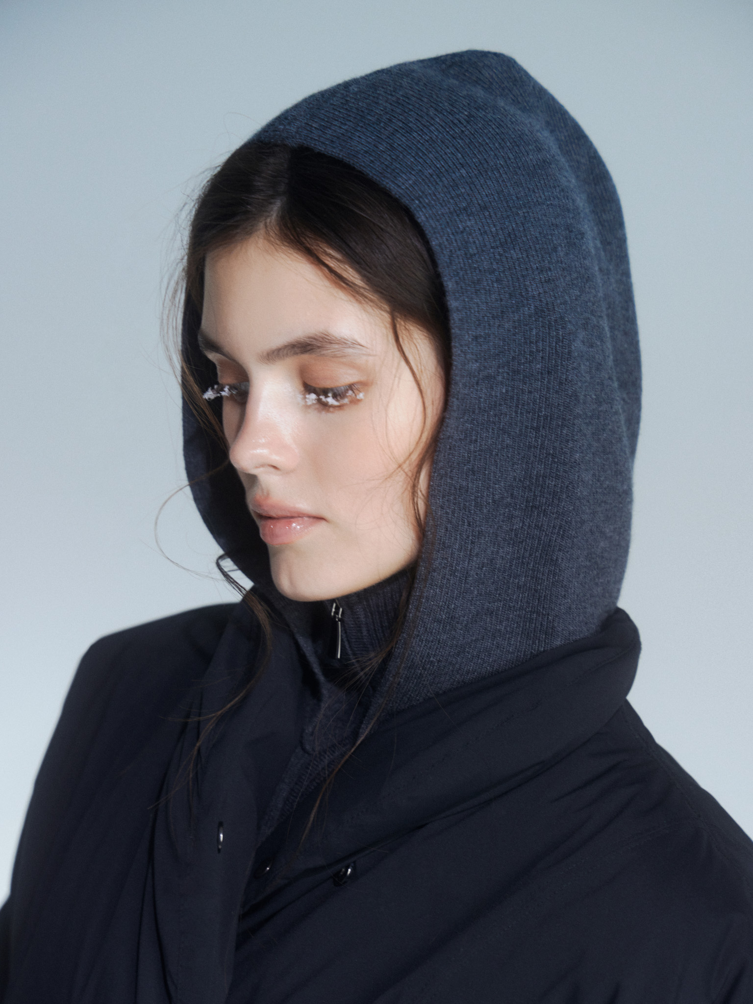 Woollen cape with high collar and zip fastening