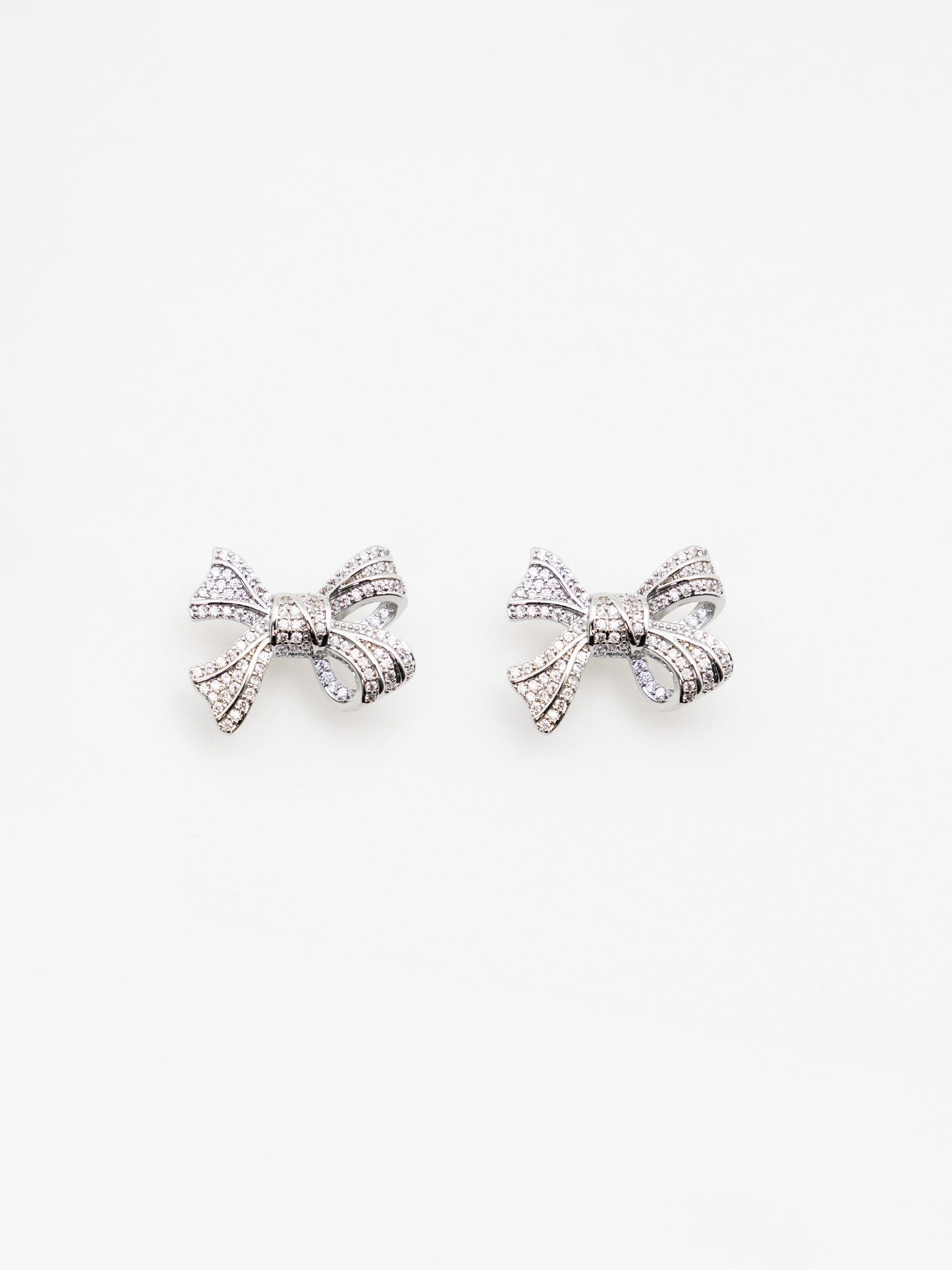 Earrings in the form of rhinestone bows