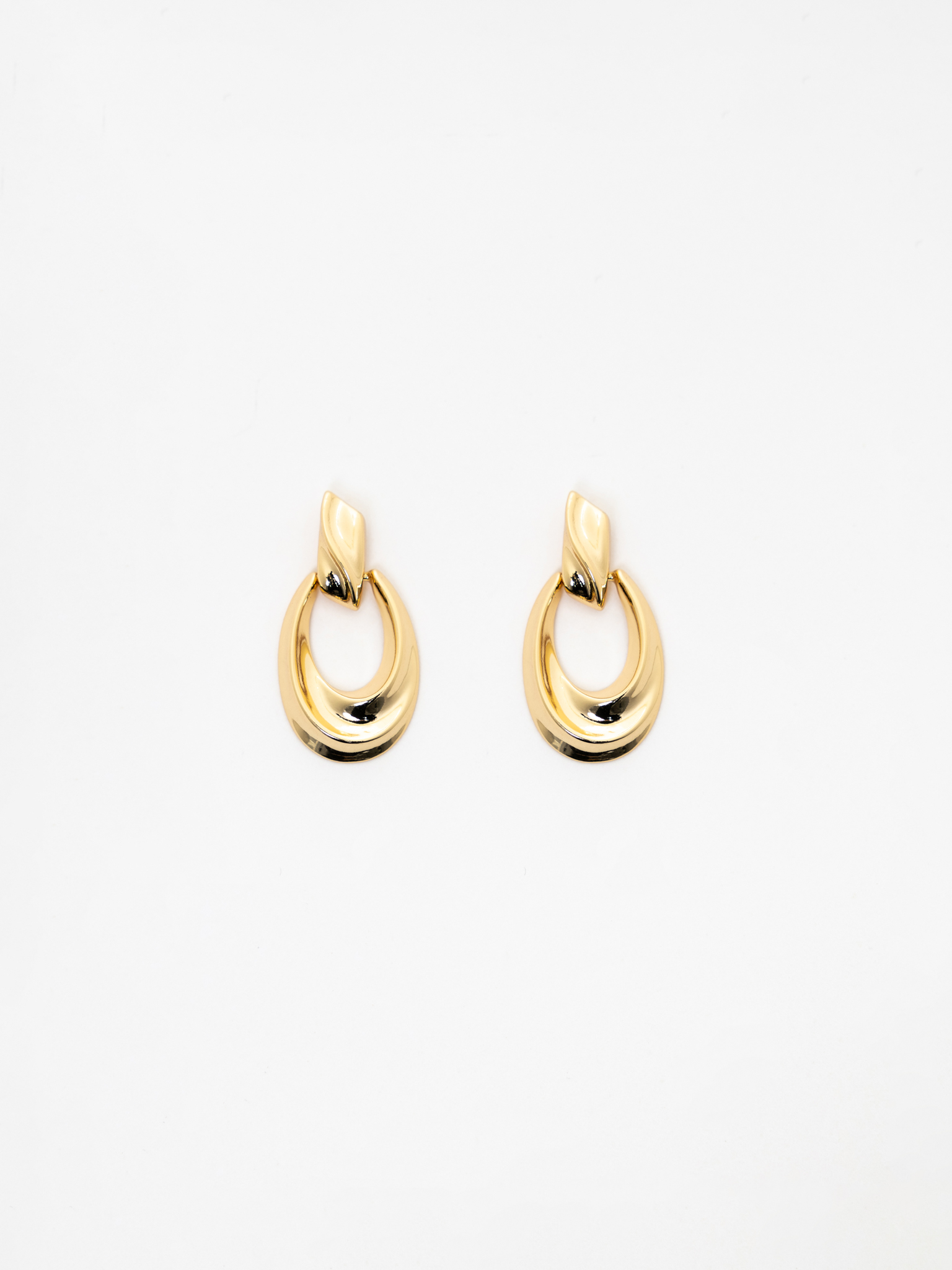 Golden stud earrings with hanging links