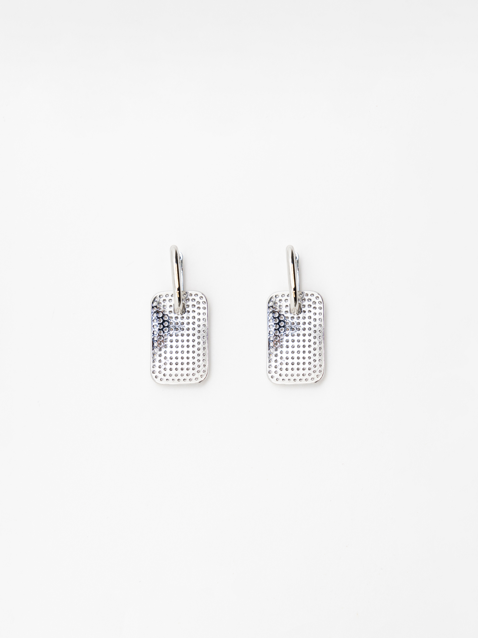 Silvertone earrings with chunky pendants