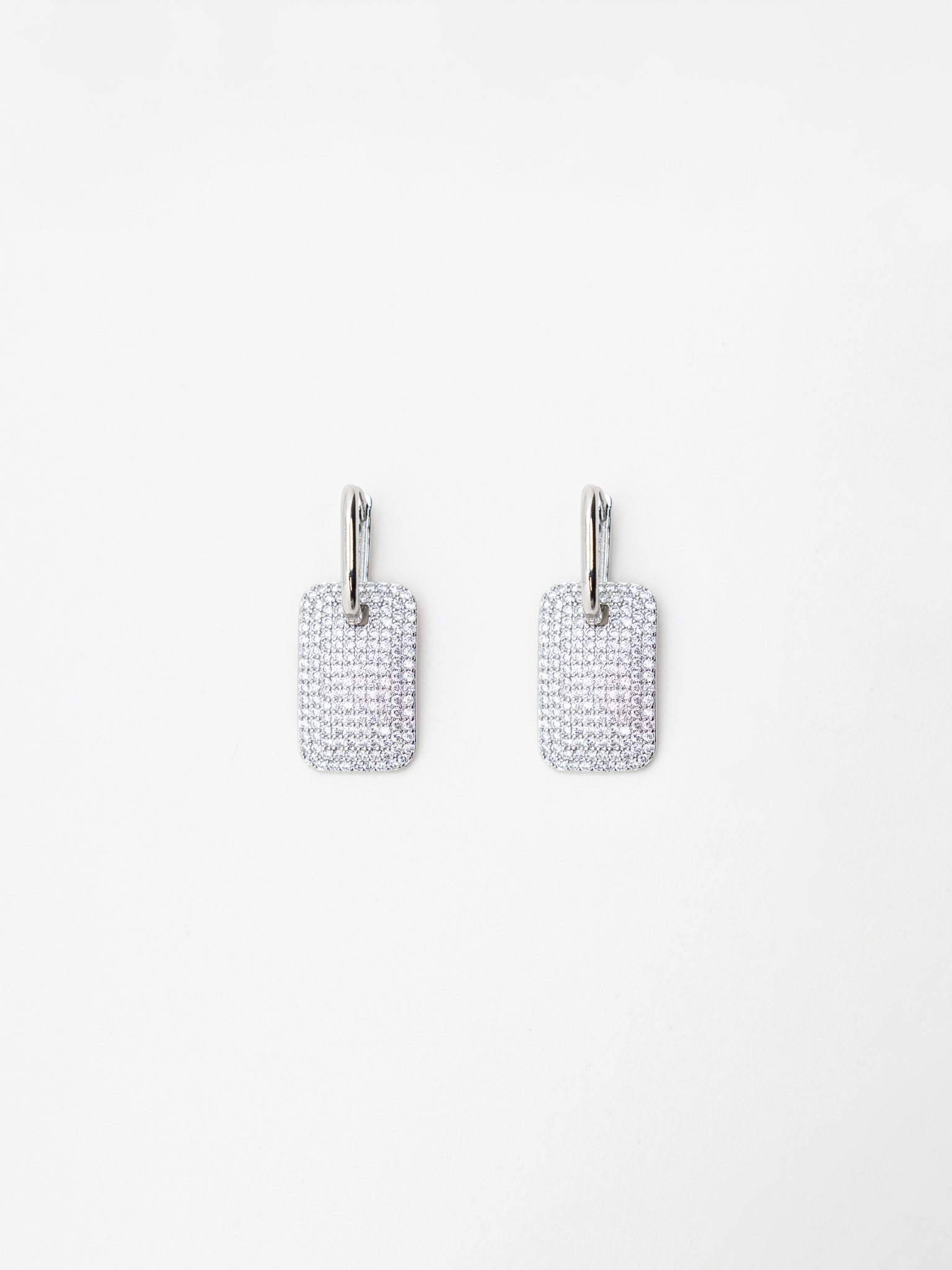 Silvertone earrings with chunky pendants