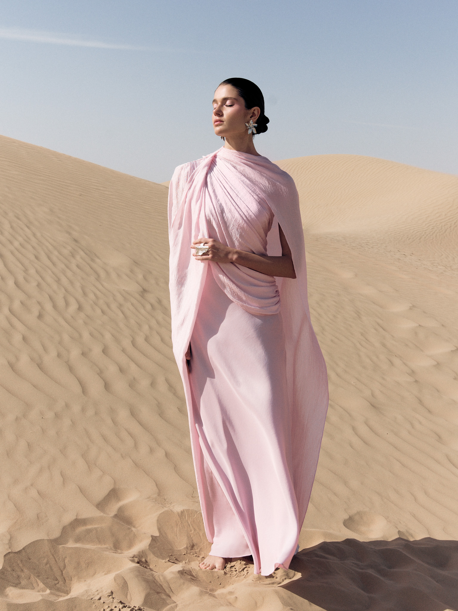 Textured maxi dress with asymmetrical draping and cape
