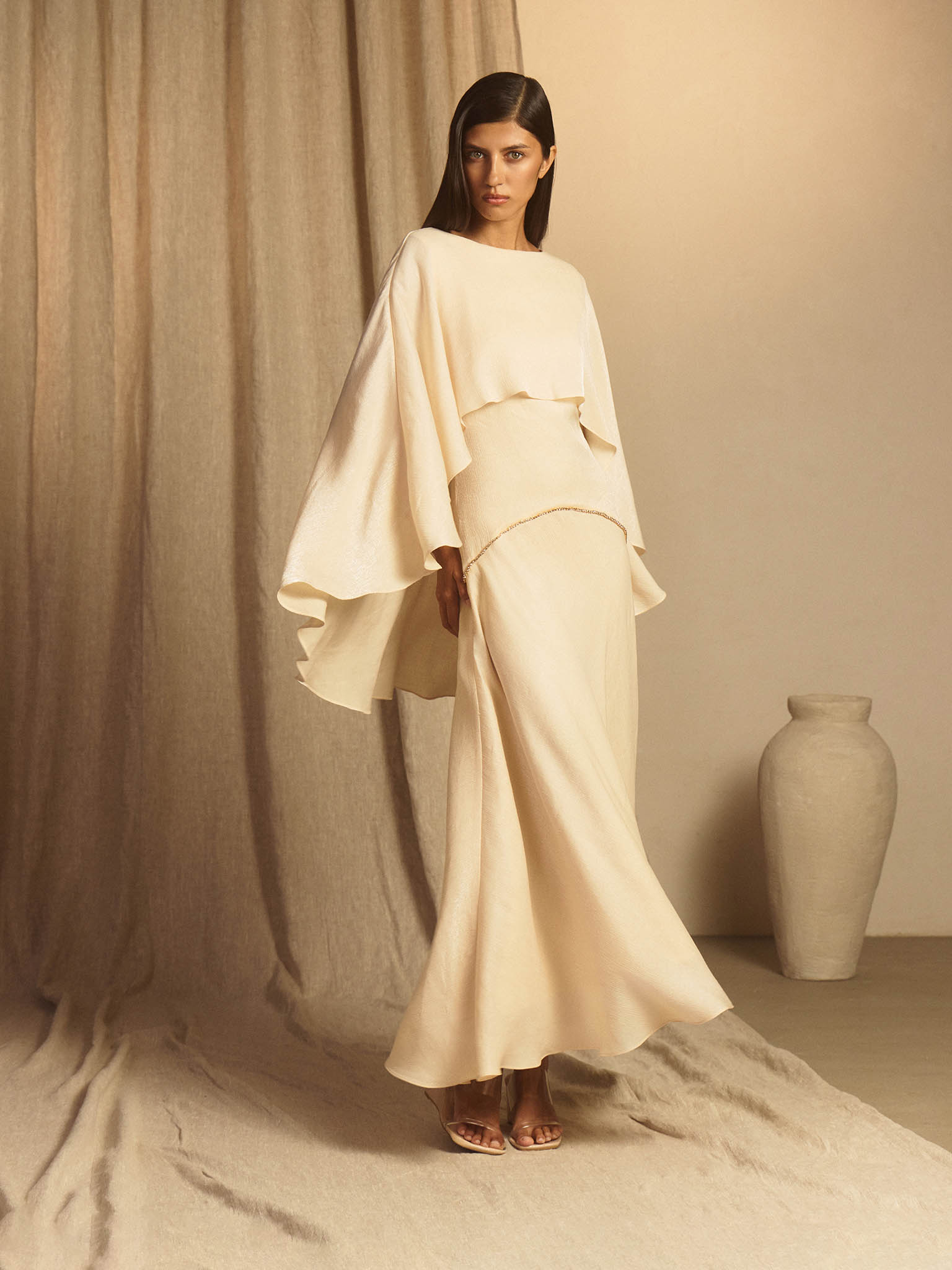 Textured maxi dress with a cape and rhinestone decor