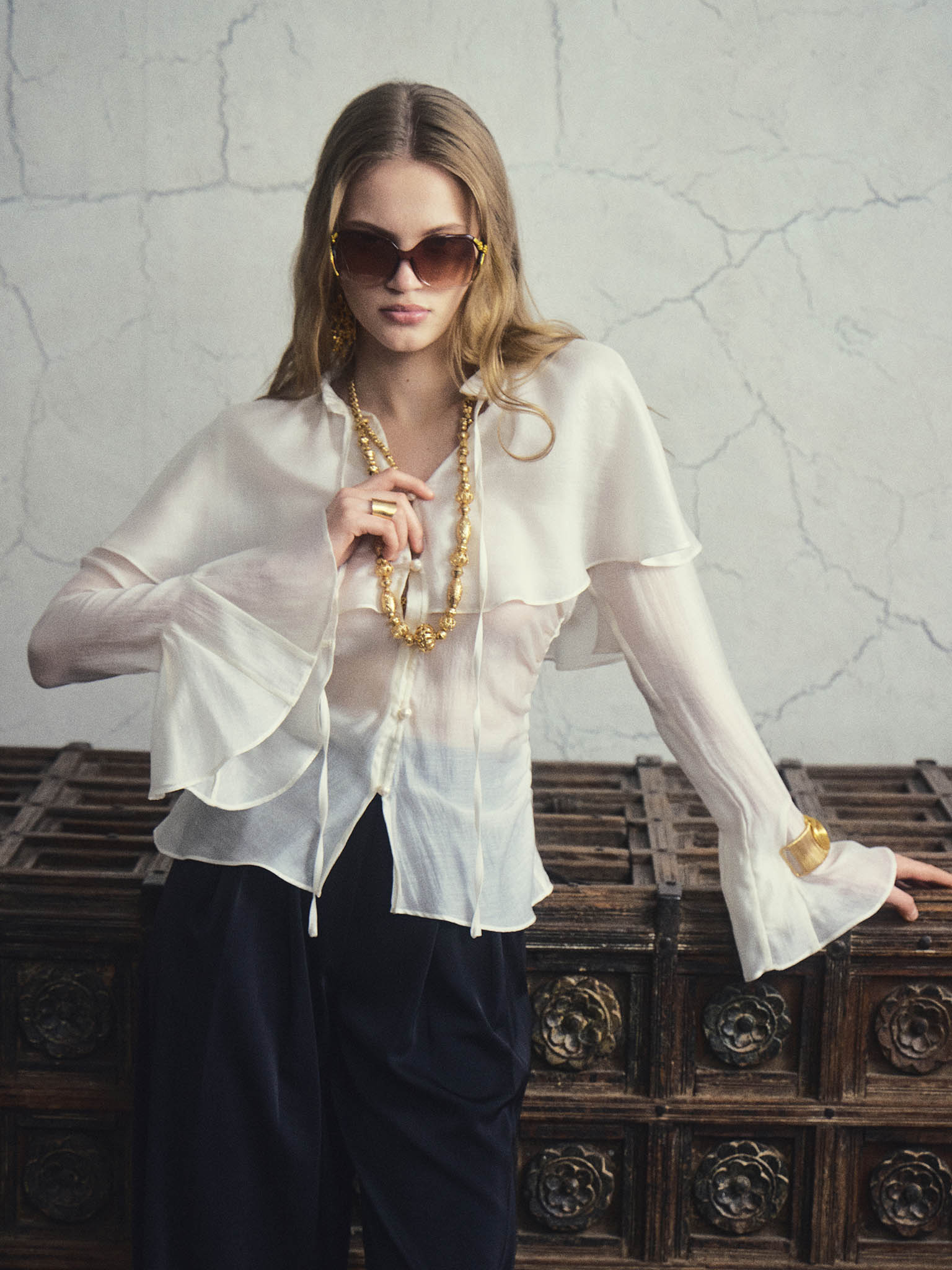 Lightweight fabric blouse with a voluminous cape