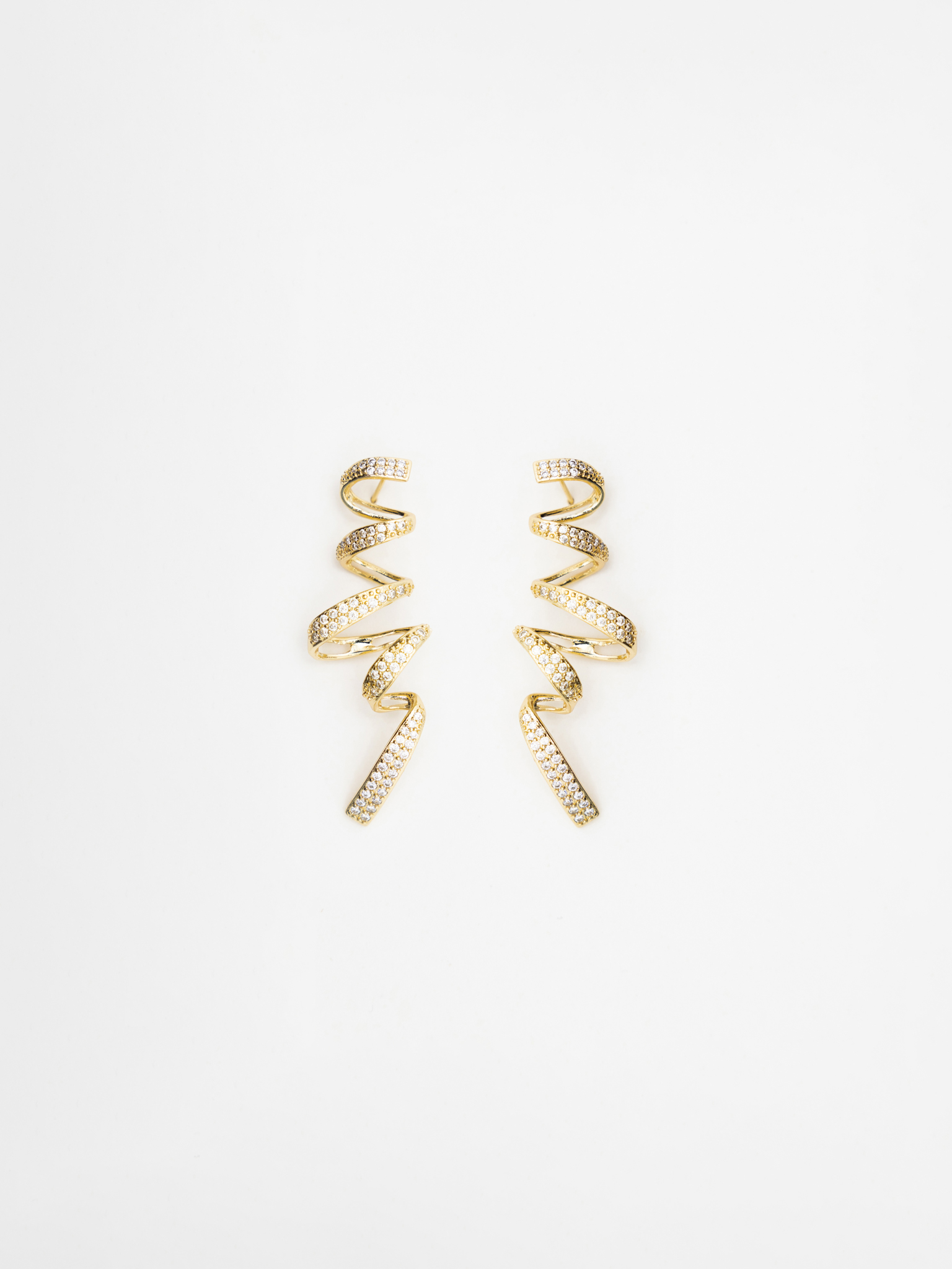Stud earrings in the form of rhinestone spirals