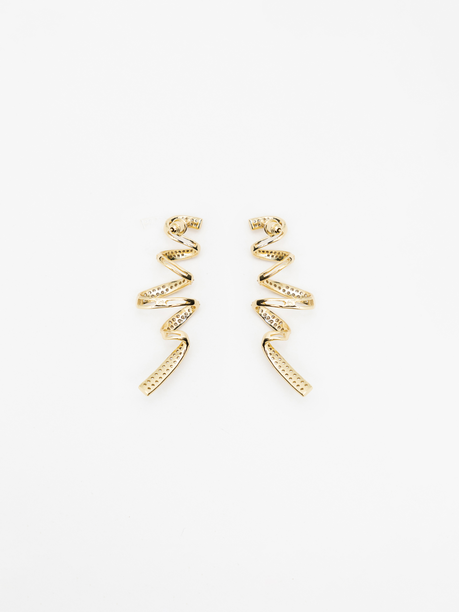 Stud earrings in the form of rhinestone spirals