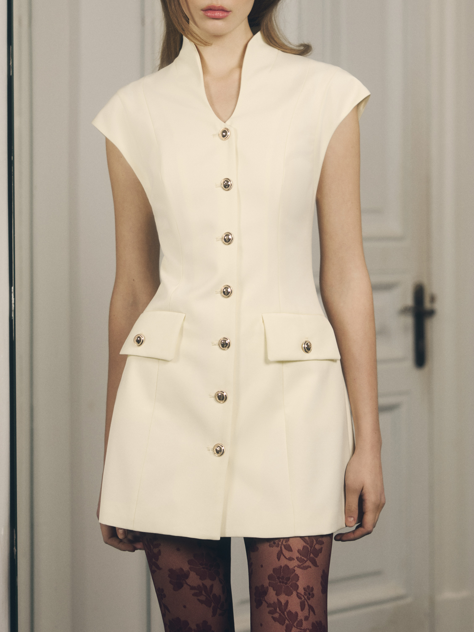 Fitted mini dress with golden buttons