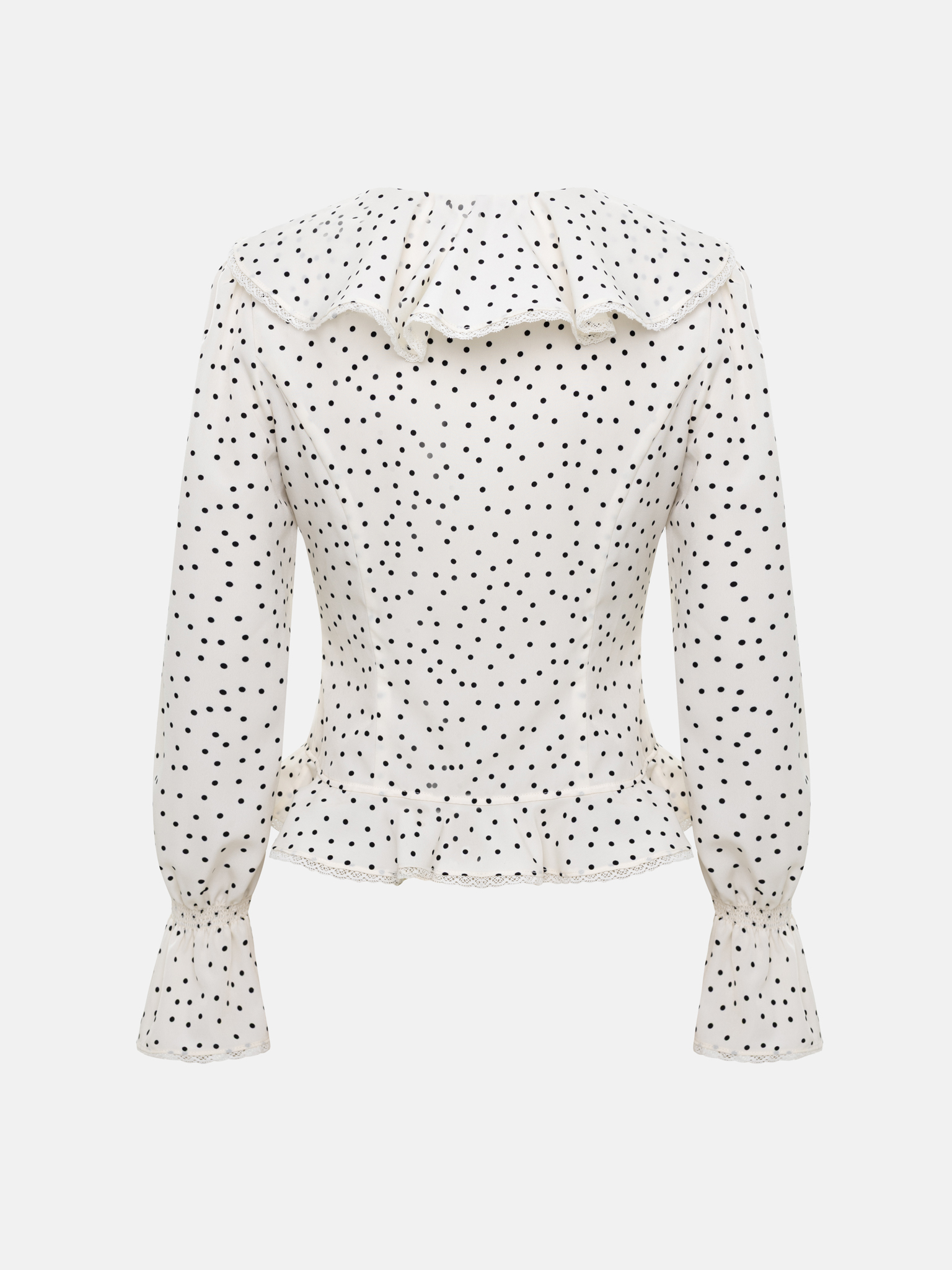 Polka dot blouse with ruffles on the collar