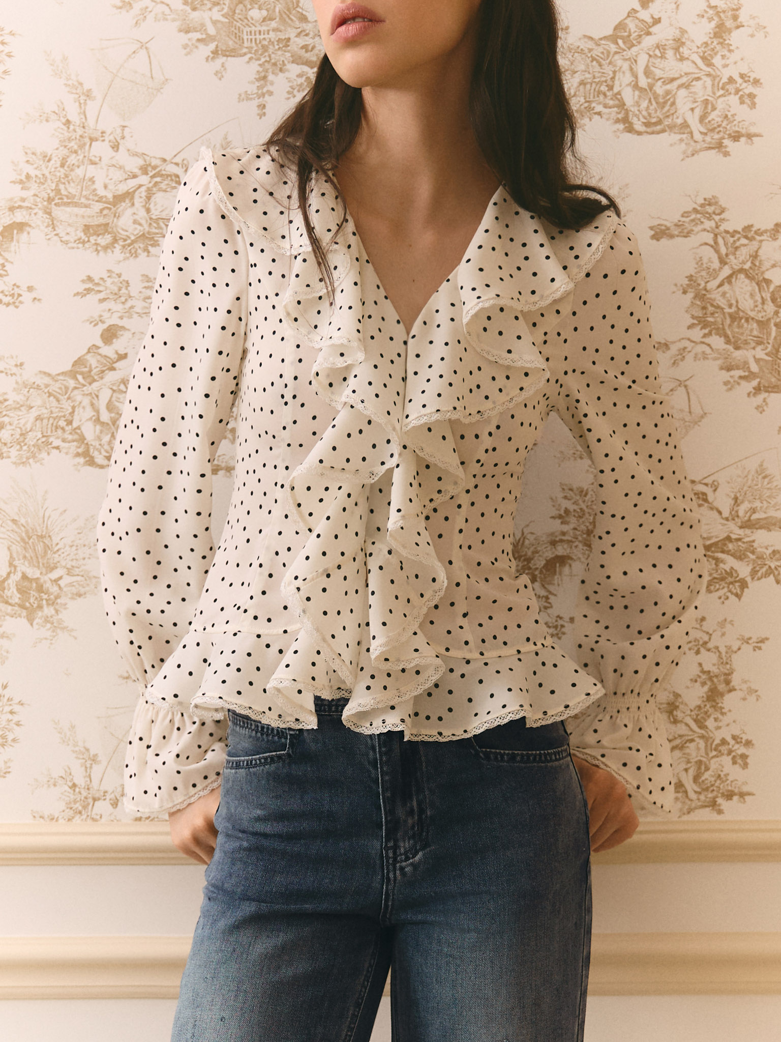 Polka dot blouse with ruffles on the collar