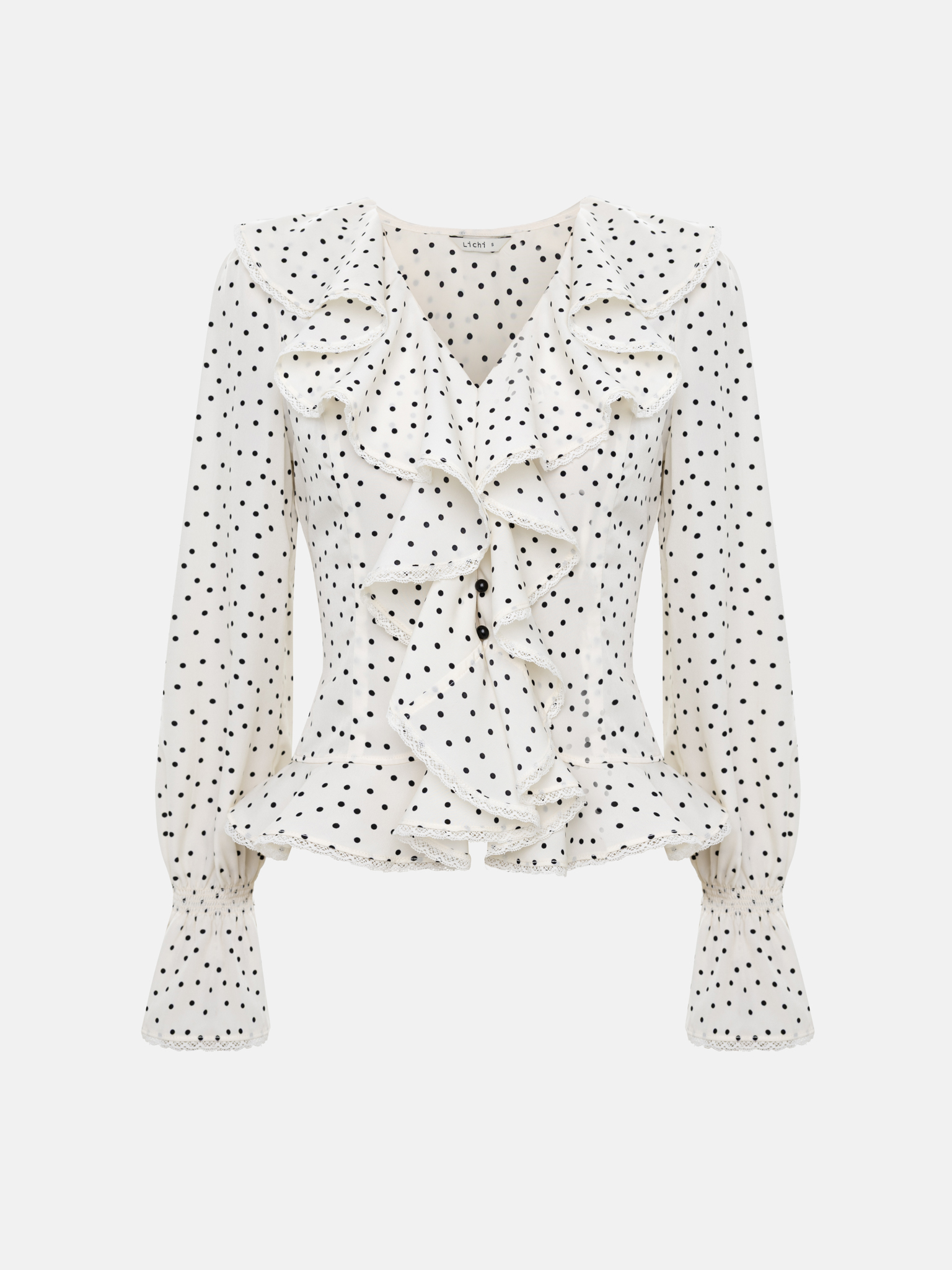 Polka dot blouse with ruffles on the collar
