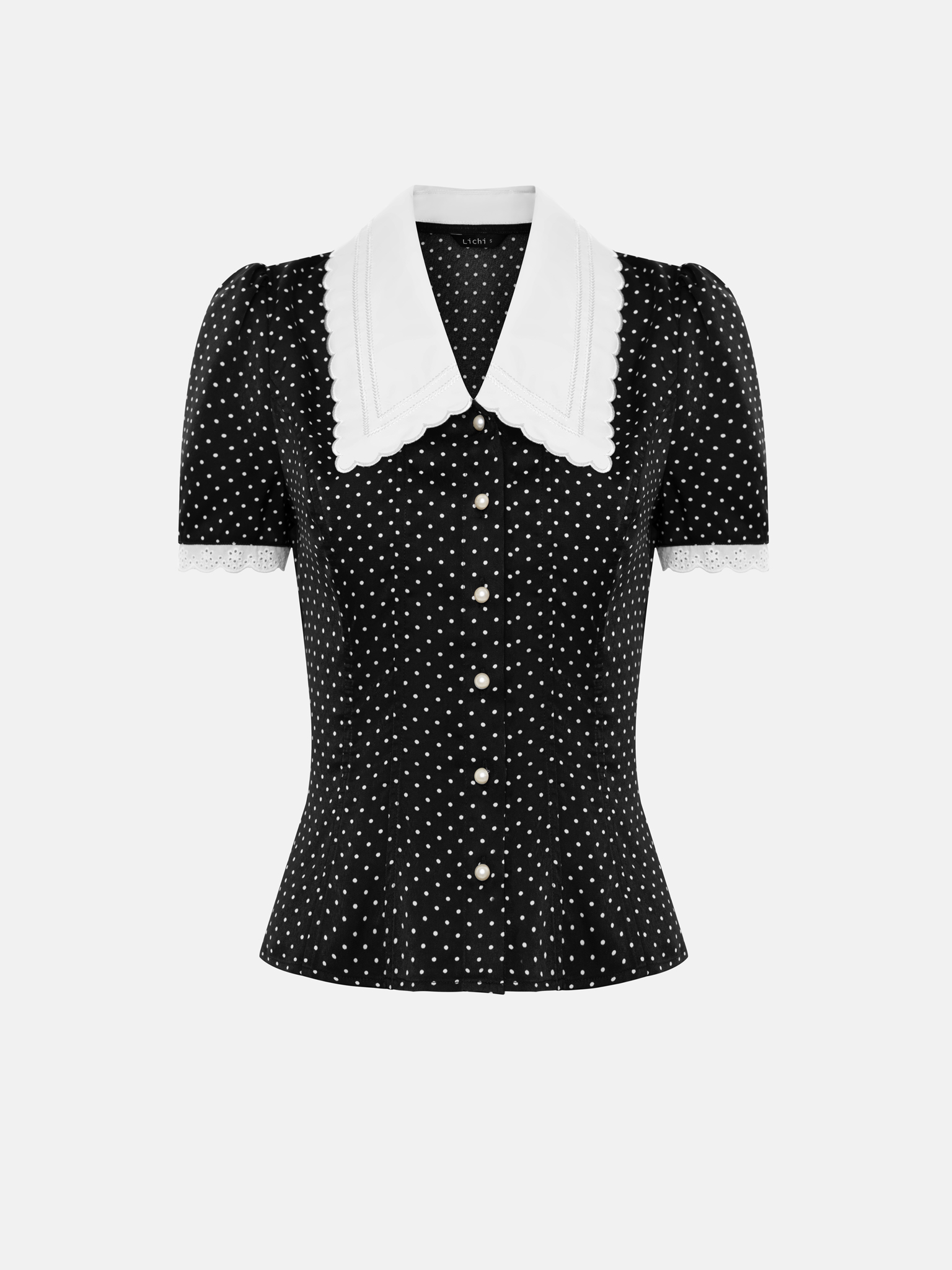 Polka dot blouse with a statement turn-down collar