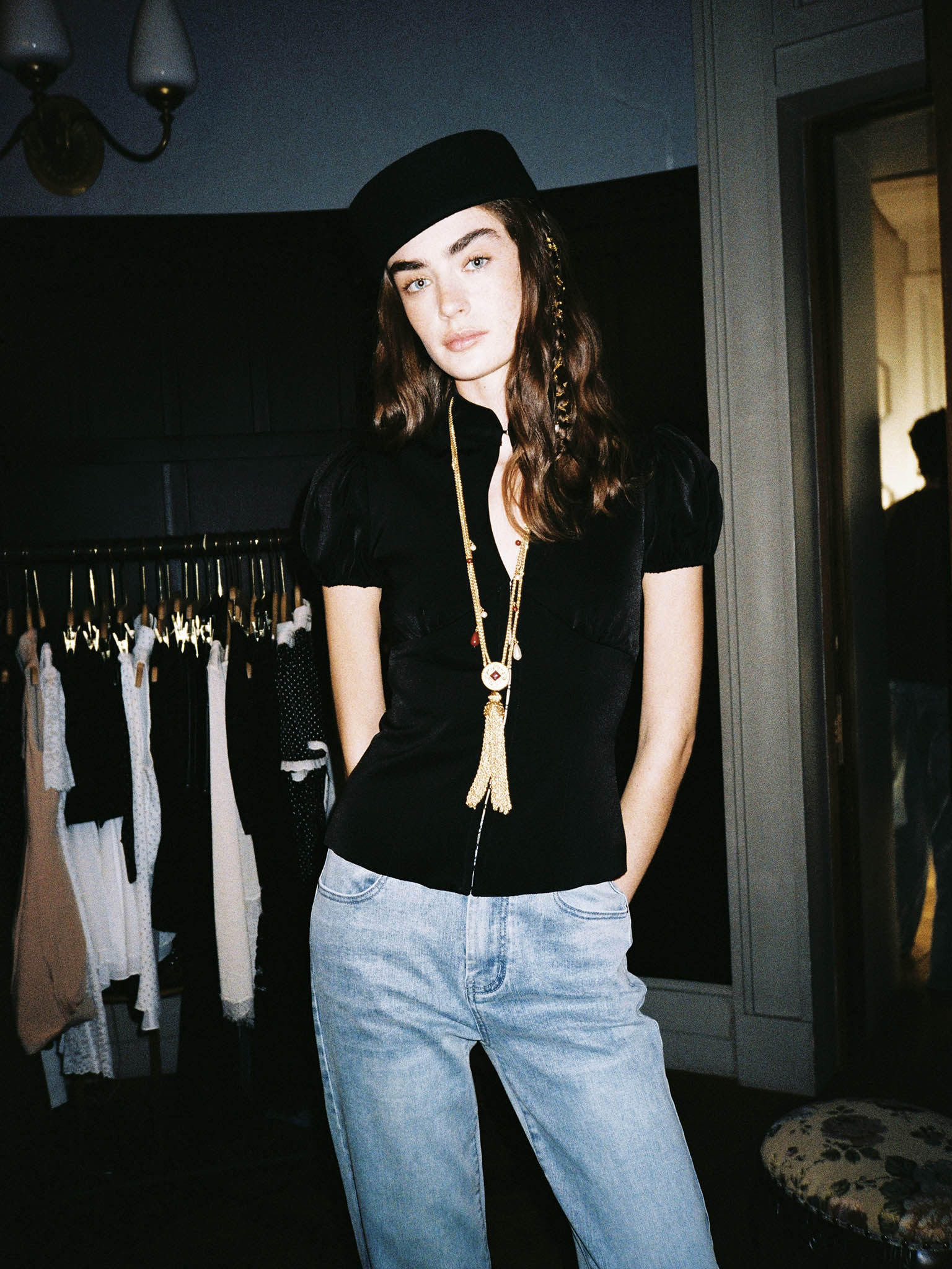 Fitted blouse with a high collar and concealed fastening