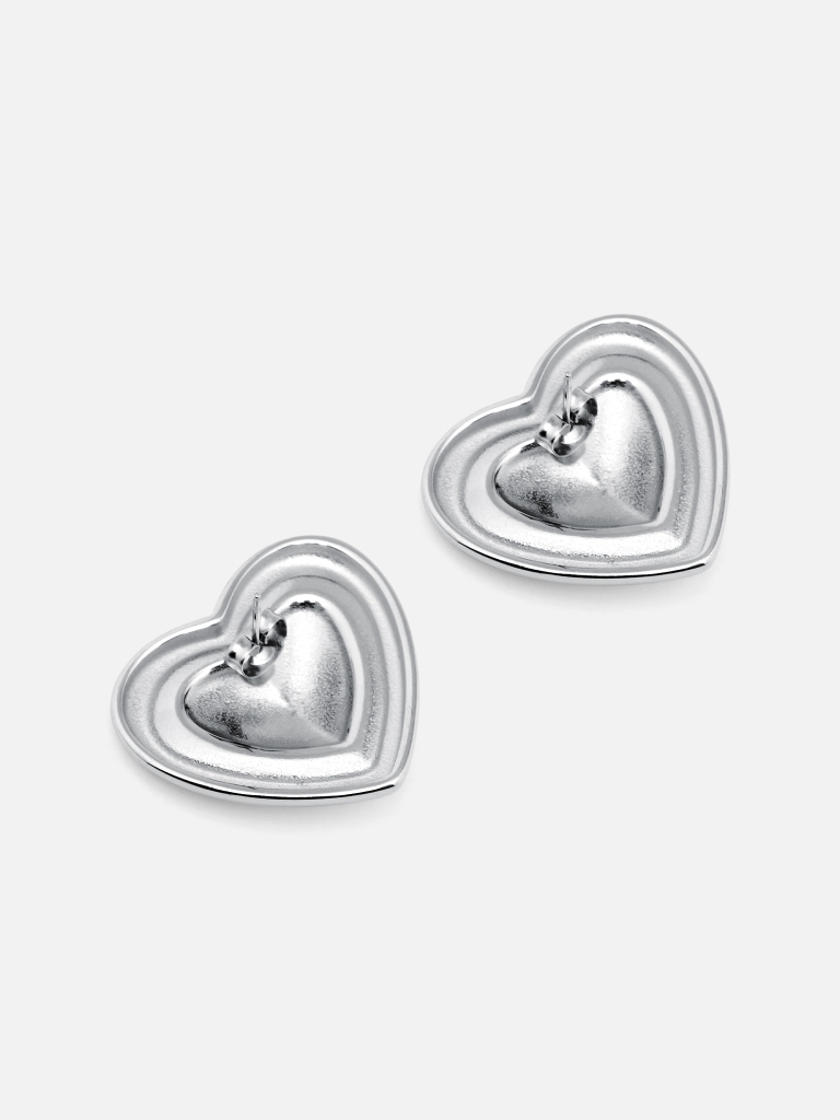 Two metal heart earrings