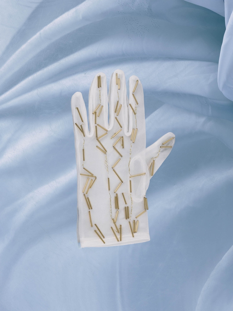 Semi-transparent gloves with golden decorations