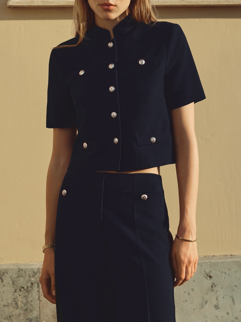 Jacket with short sleeves and oversized buttons