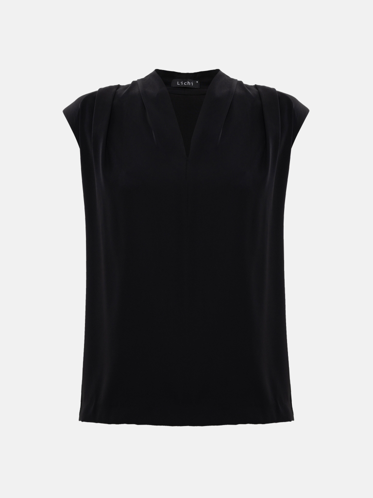 Top with voluminous shoulders and V-neckline