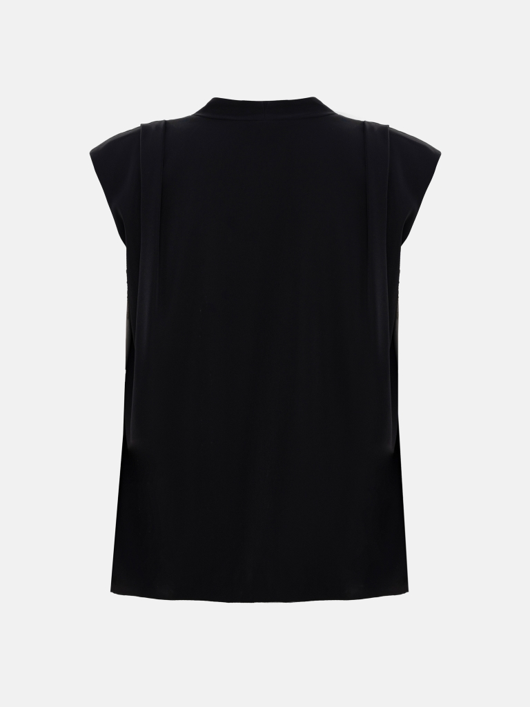 Top with voluminous shoulders and V-neckline