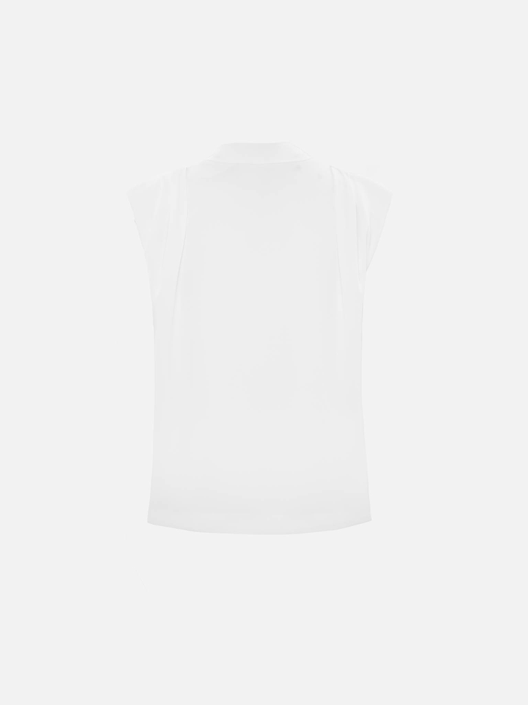 Top with voluminous shoulders and V-neckline