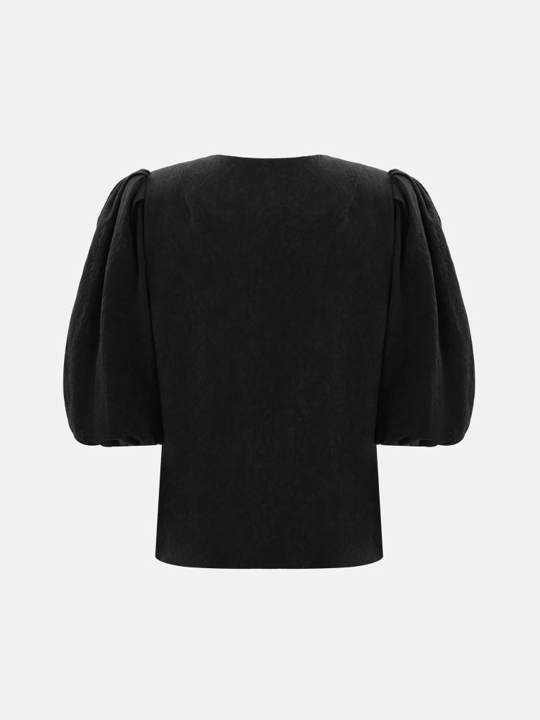 Textured blouse with a voluminous bow