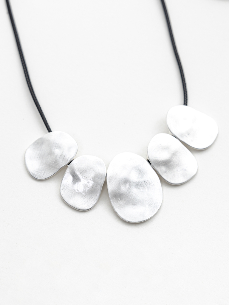 Eco-leather cord necklace with silvertone pendants