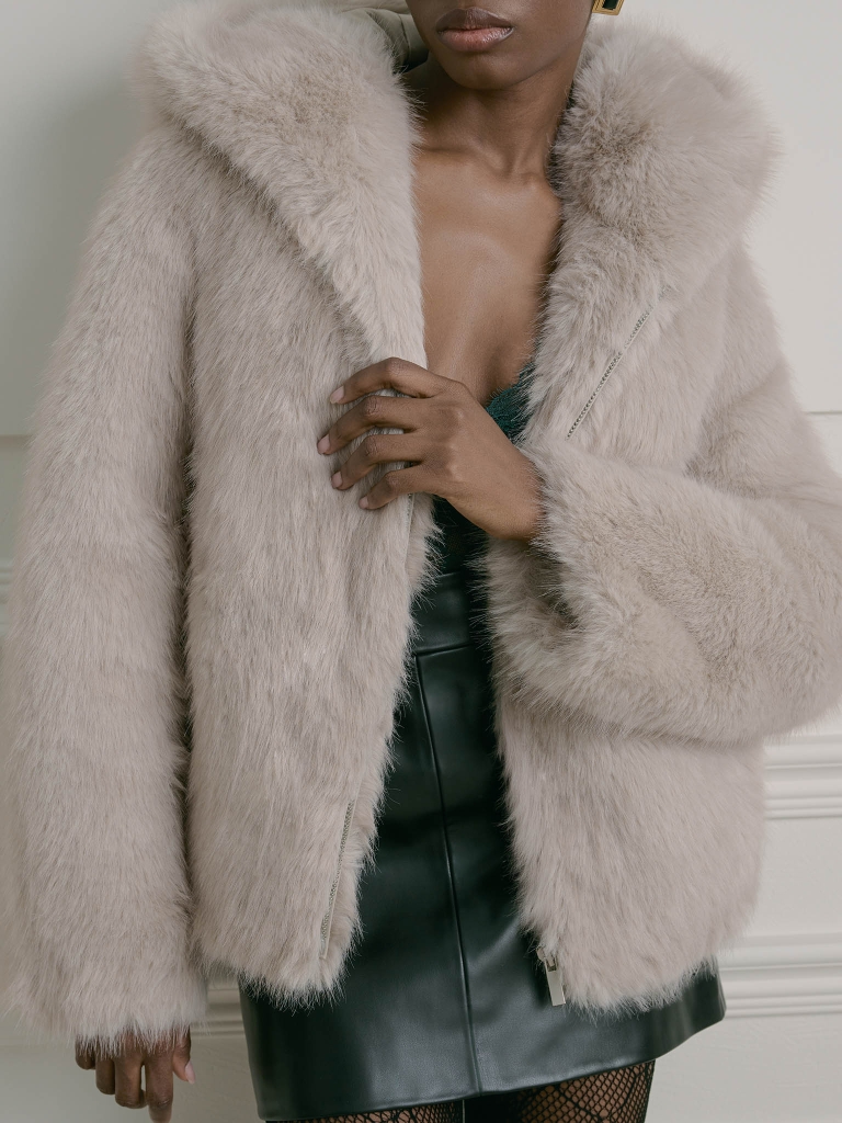 Short eco-fur coat with a zip and a hood