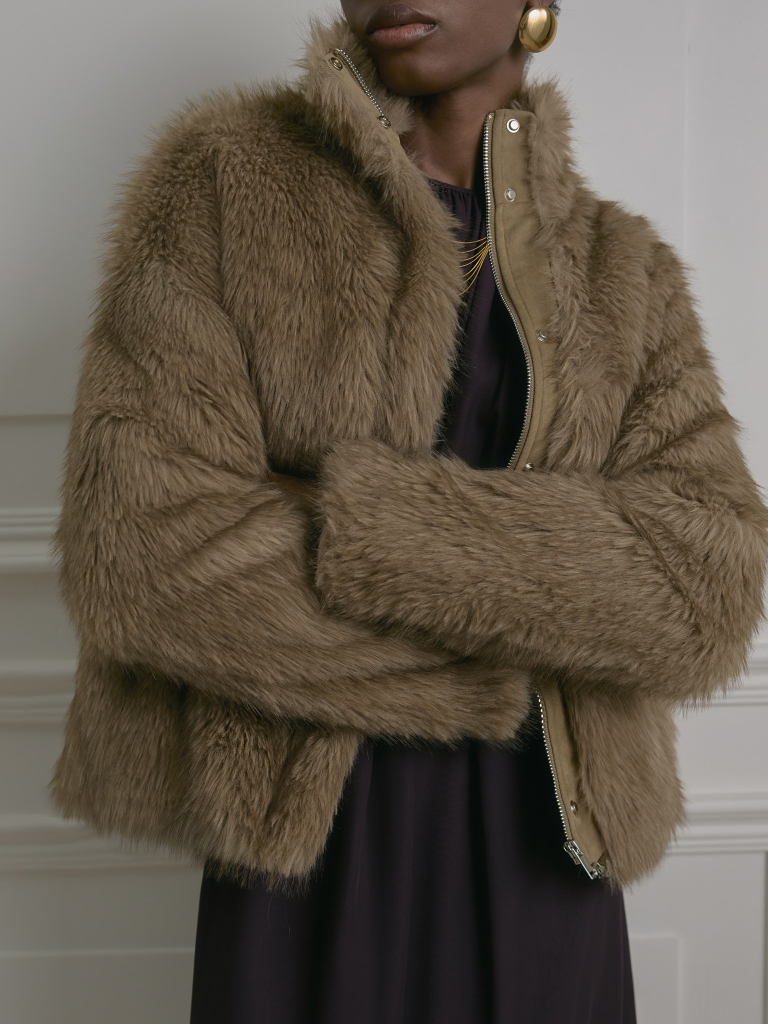 Short eco-fur coat with zip fastening and stand-up collar
