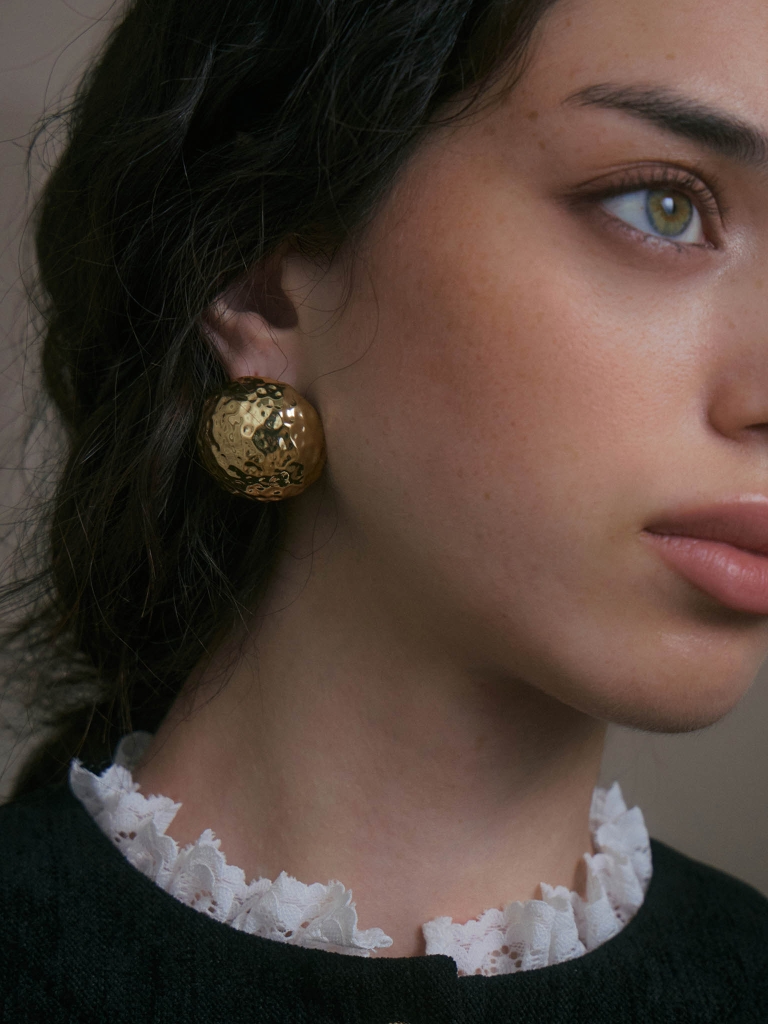 Round stud earrings in textured metal