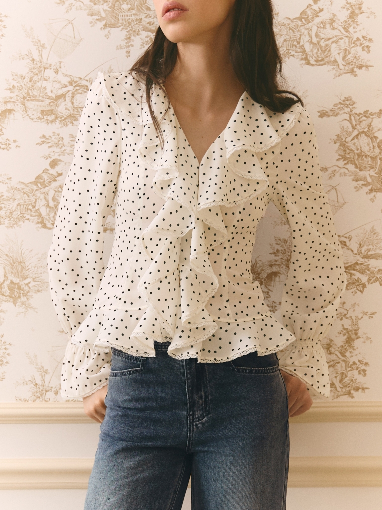 Polka dot blouse with ruffles on the collar