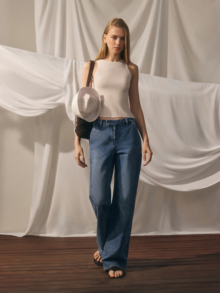 Flared denim jeans with distressed details