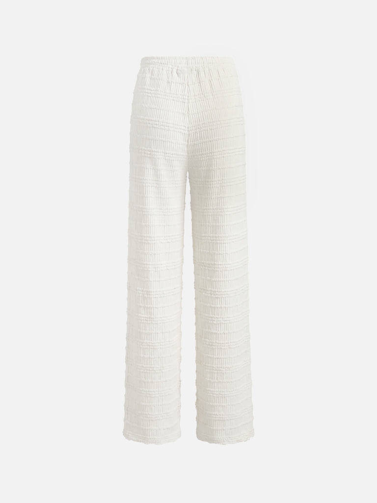 Loose-fitting trousers in crinkled fabric