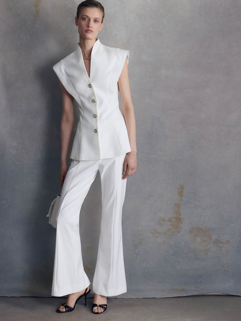 Fitted waistcoat with accentuated shoulders and peplum
