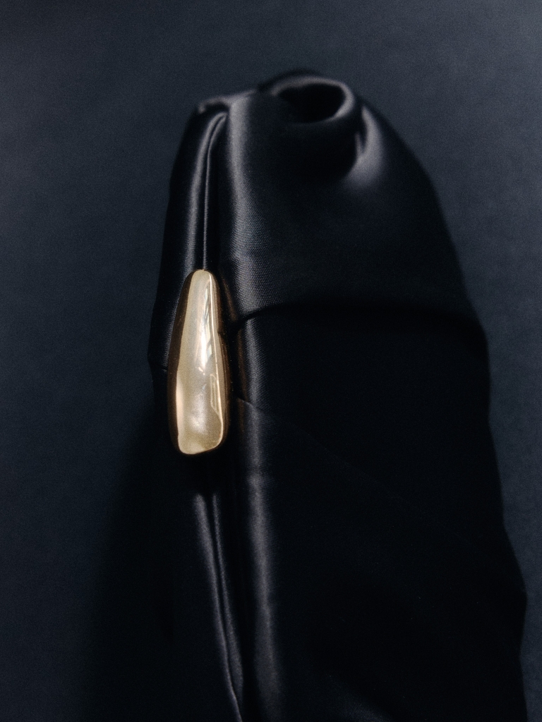 Clutch bag with golden decor