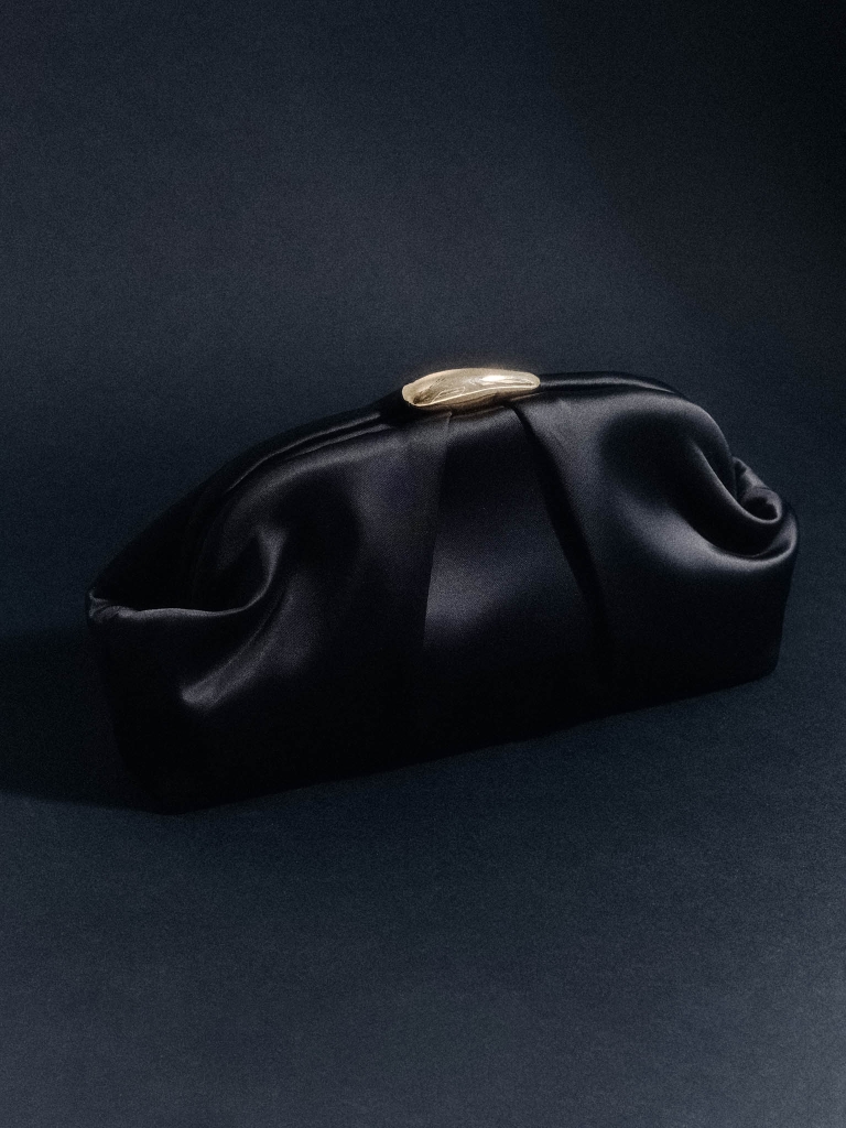 Clutch bag with golden decor