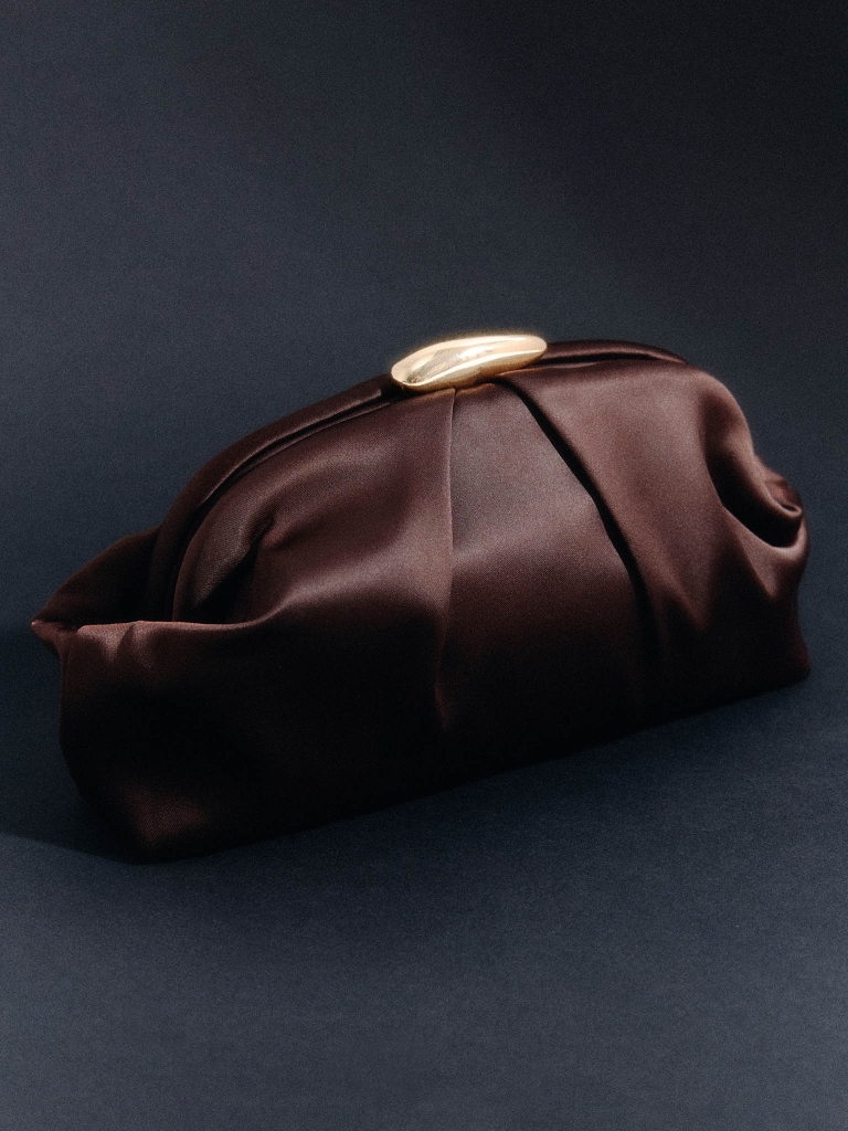 Clutch bag with golden decor