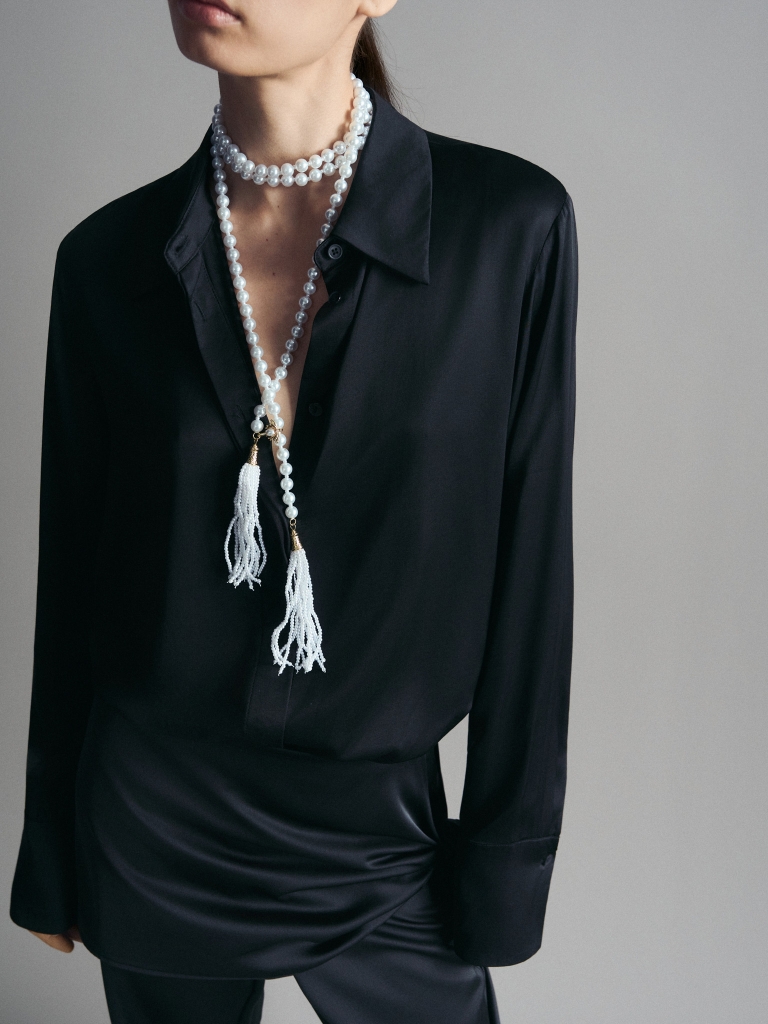 Long pearl necklace with tassel pendants