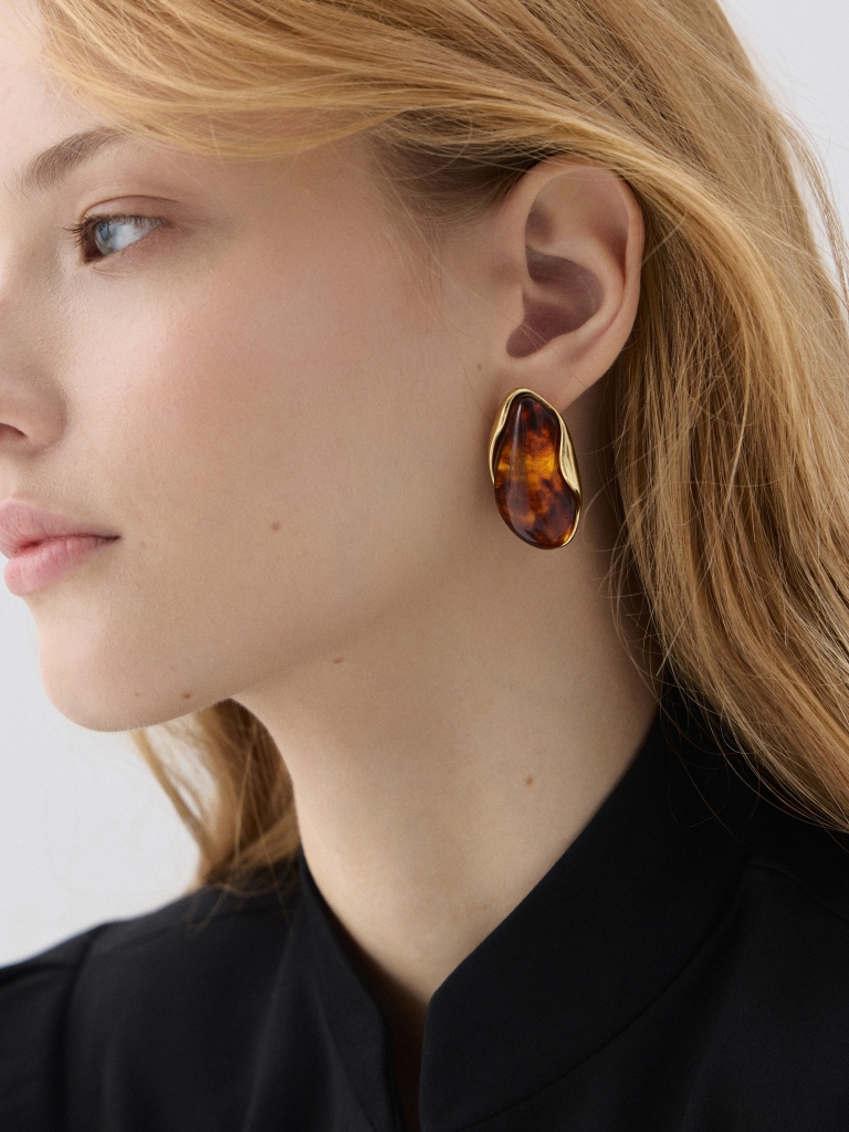 Abstract-shaped stud earrings with stones in the center