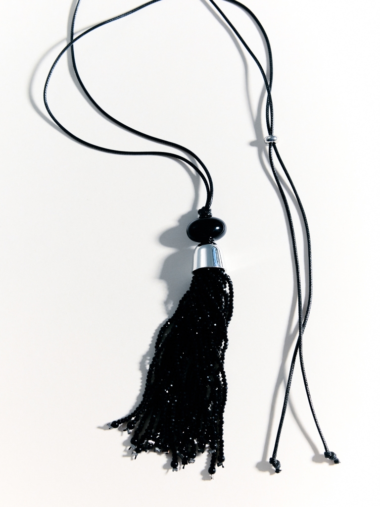 Cord necklace with a beaded tassel