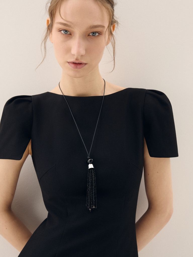Cord necklace with a beaded tassel