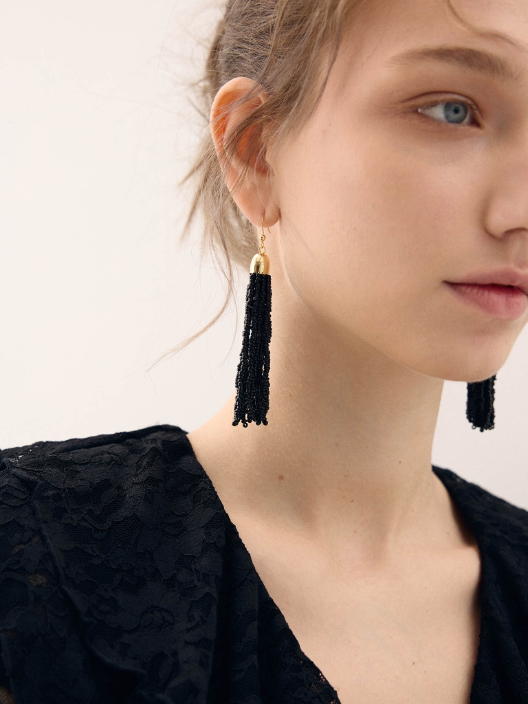 Golden earrings with beaded tassels